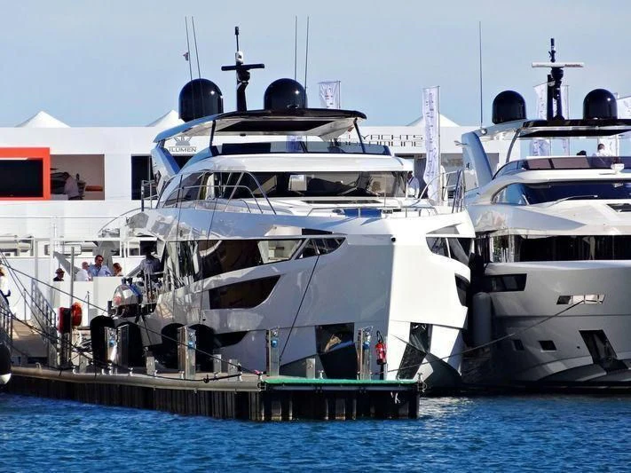 a large white boat docked aboard MAXIMUS Yacht for Sale