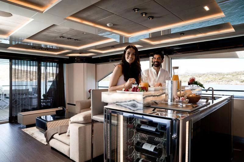 a group of people standing in a kitchen aboard MAXIMUS Yacht for Sale