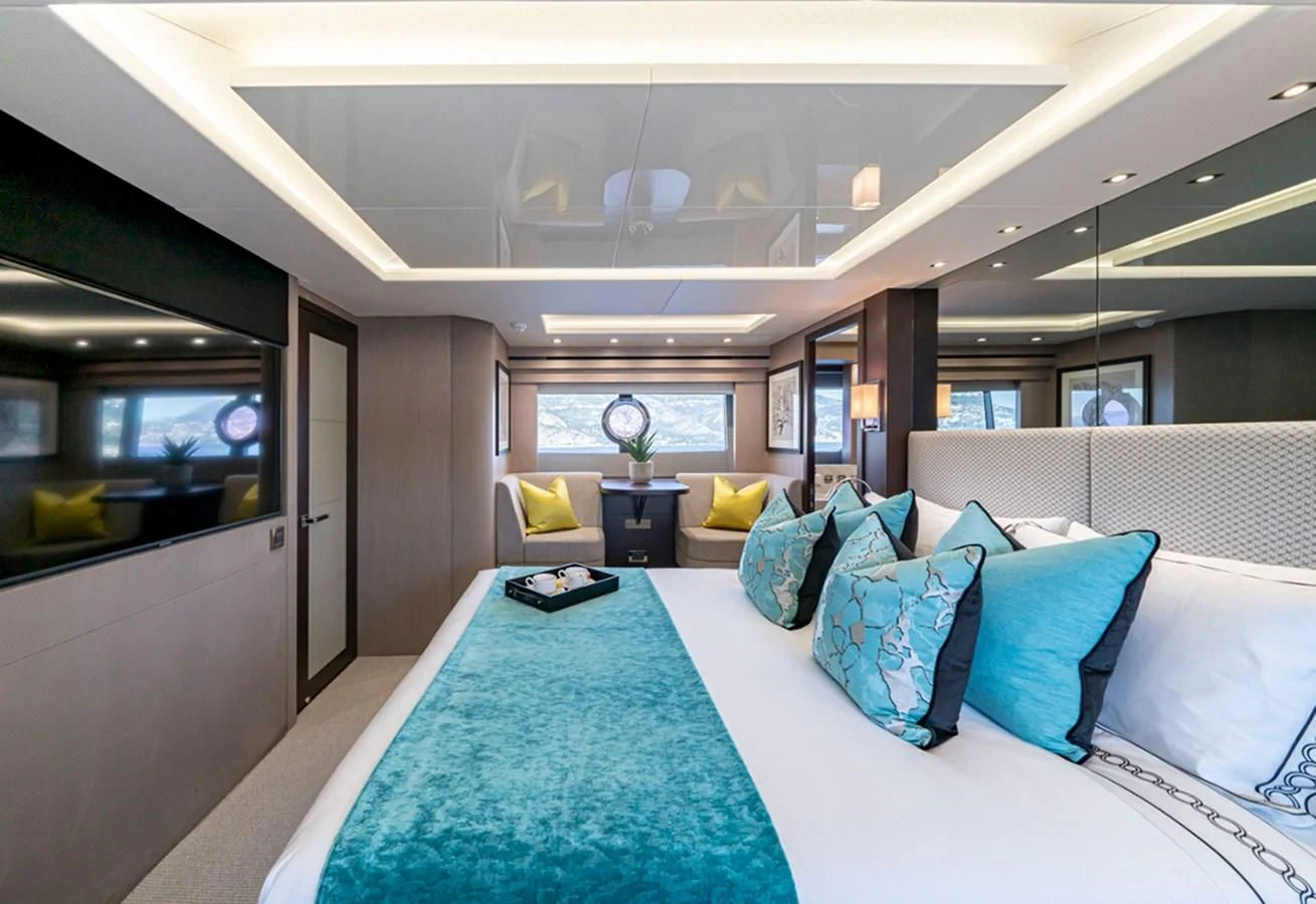 a large bed in a room aboard TORO Yacht for Sale