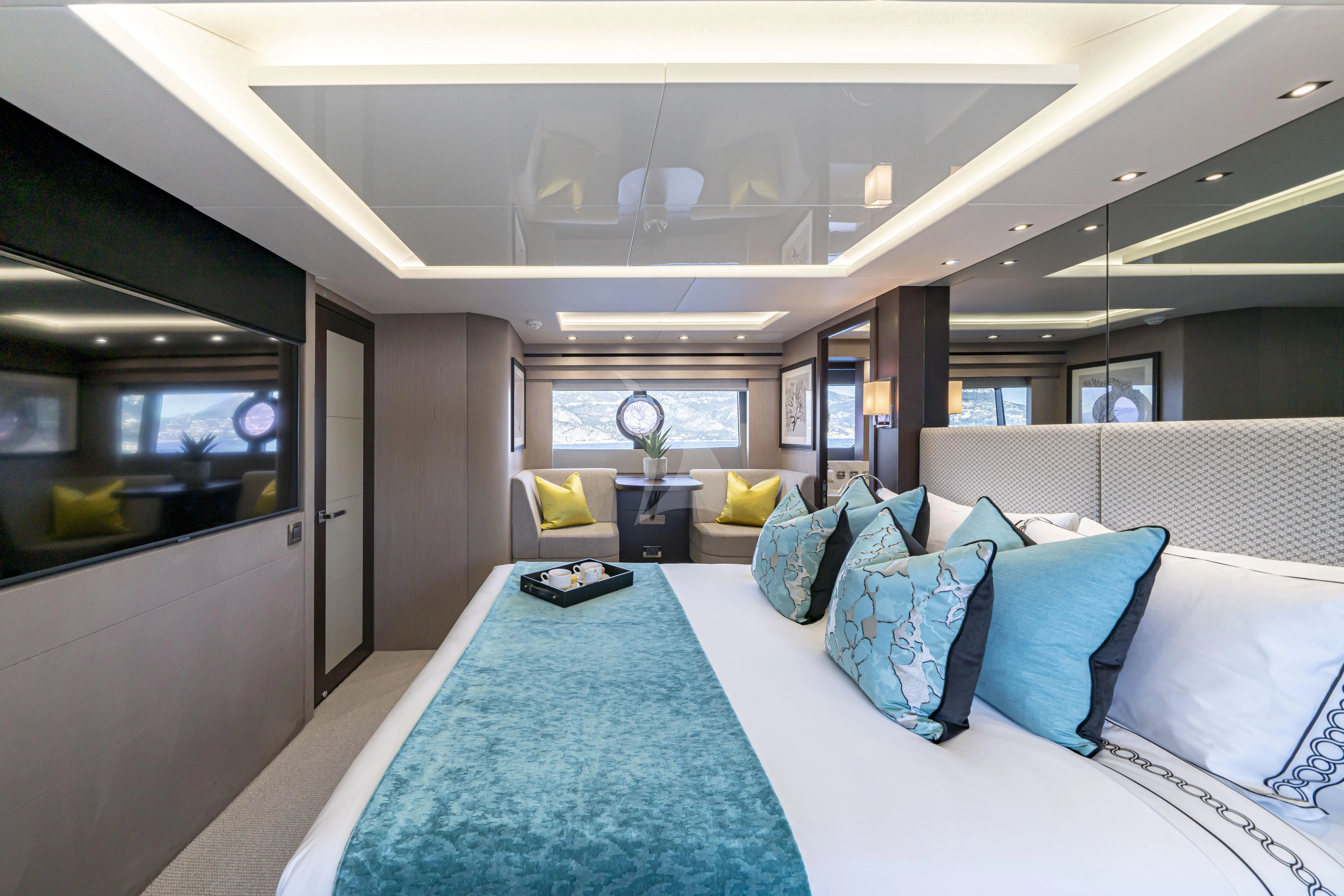 a large bed in a room aboard TORO Yacht for Sale