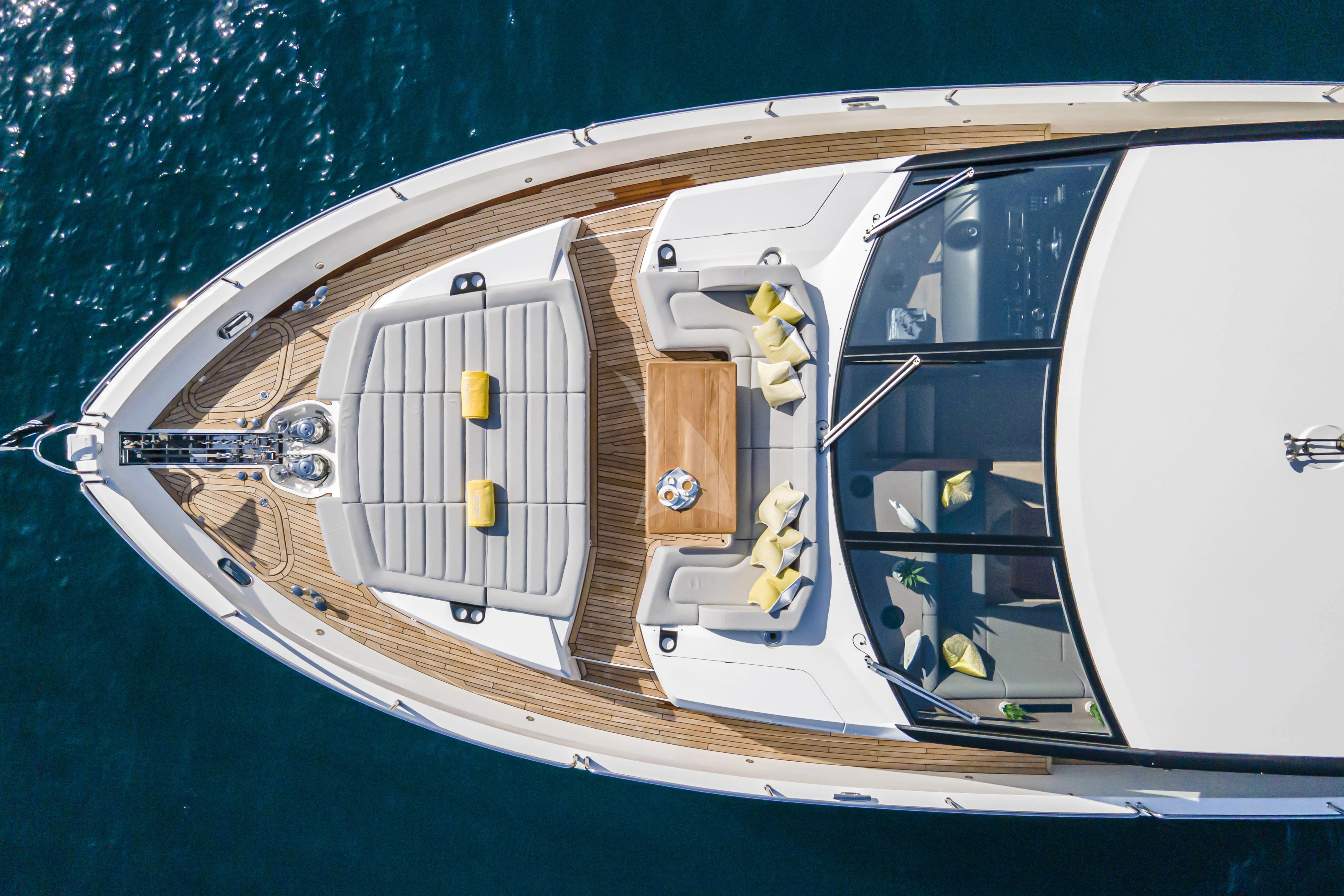 a white boat with a white stripe aboard TORO Yacht for Sale