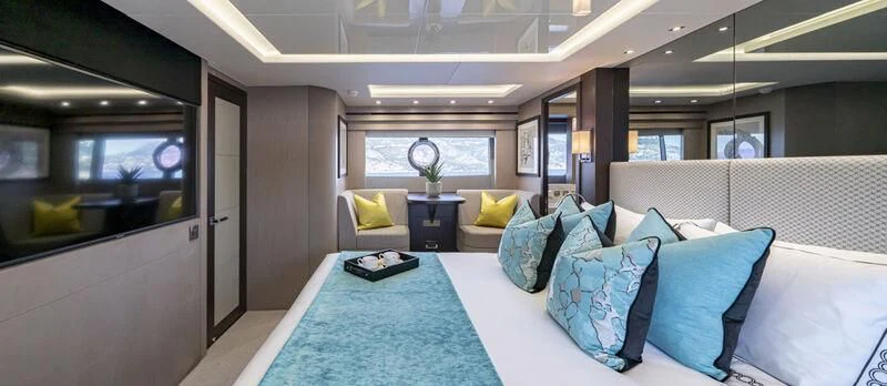 a large bed in a room aboard TORO Yacht for Sale