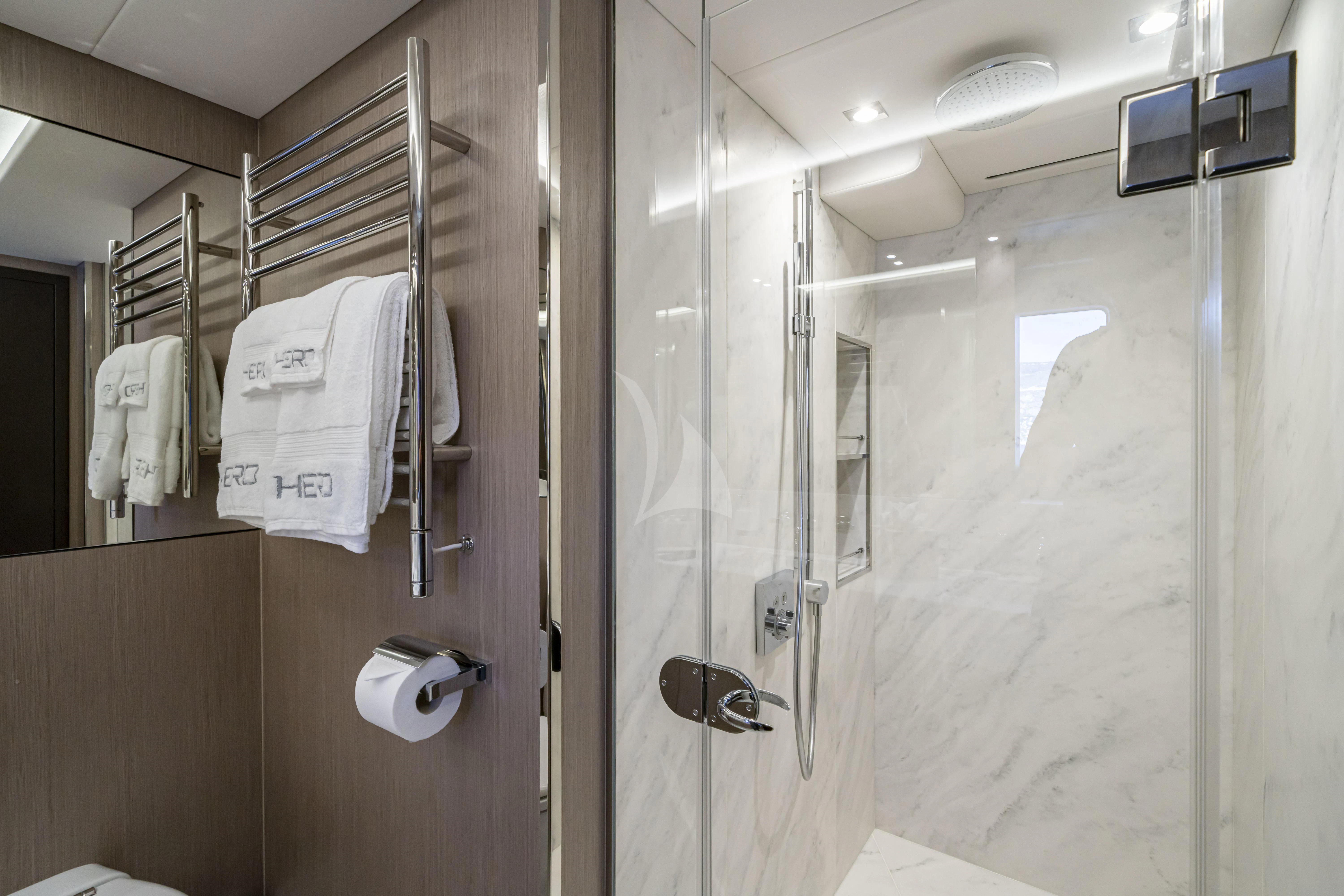 a bathroom with a towel rack and a mirror aboard TORO Yacht for Sale