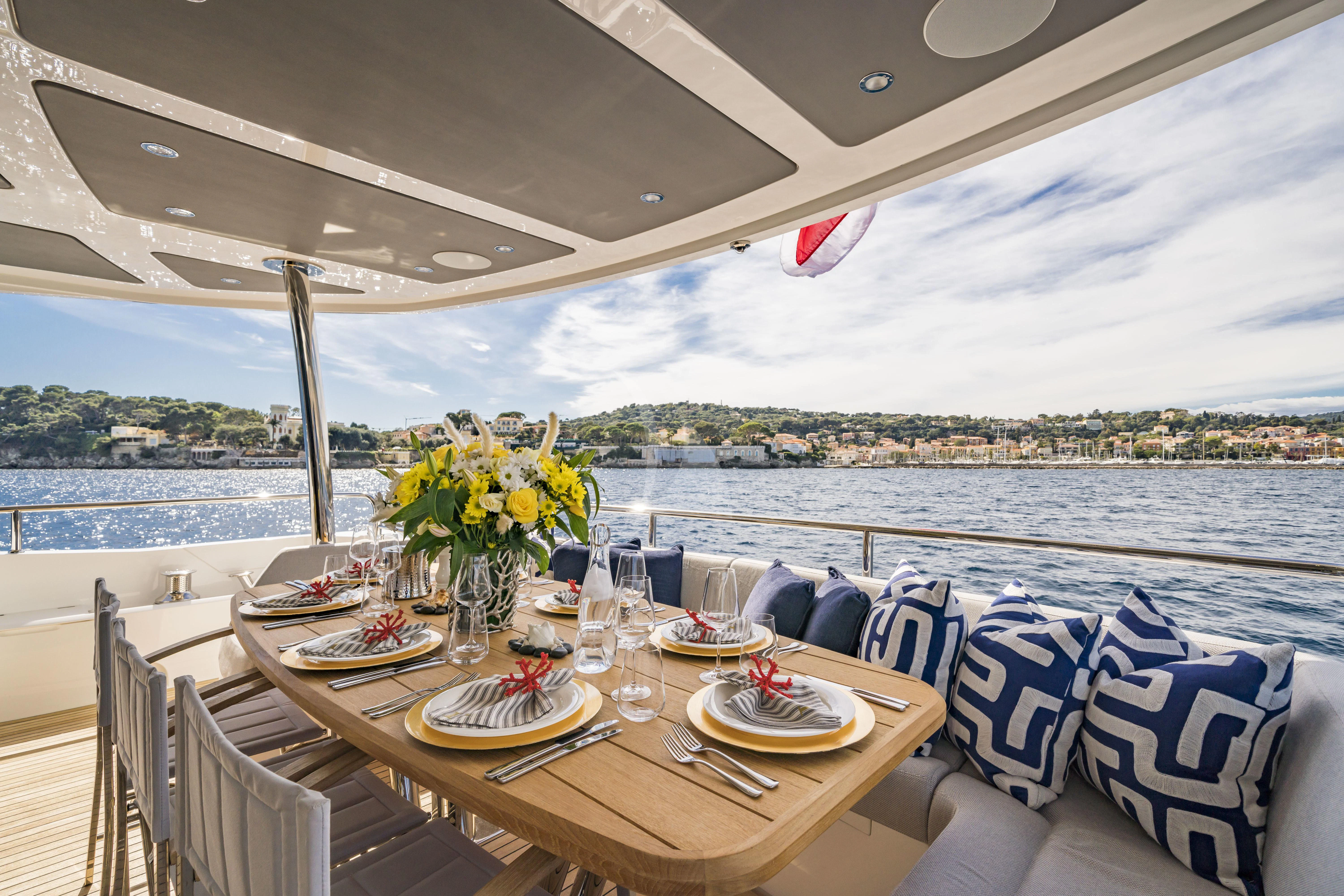 a table set for a meal on a boat aboard TORO Yacht for Sale