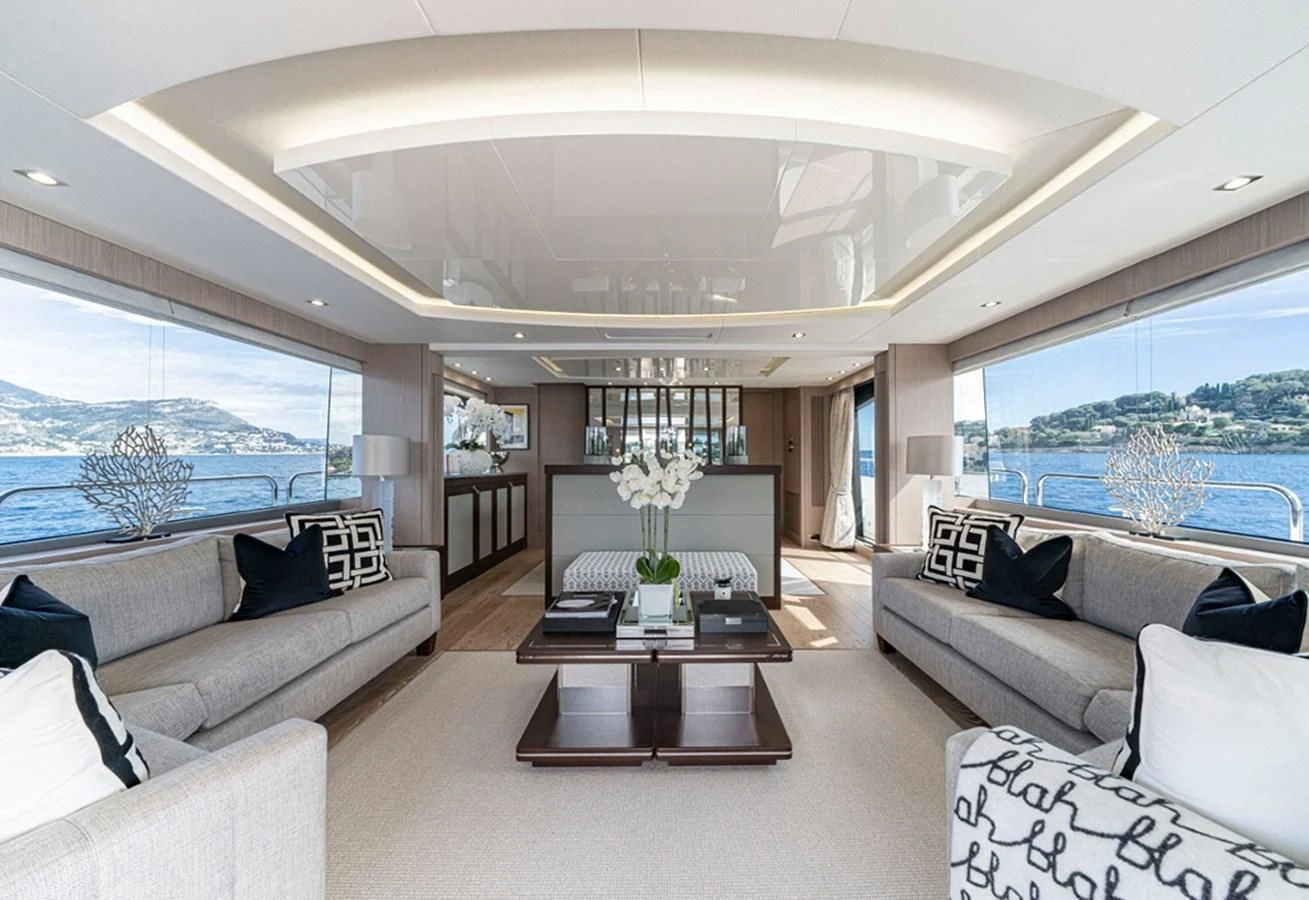 a living room with a large window aboard TORO Yacht for Sale