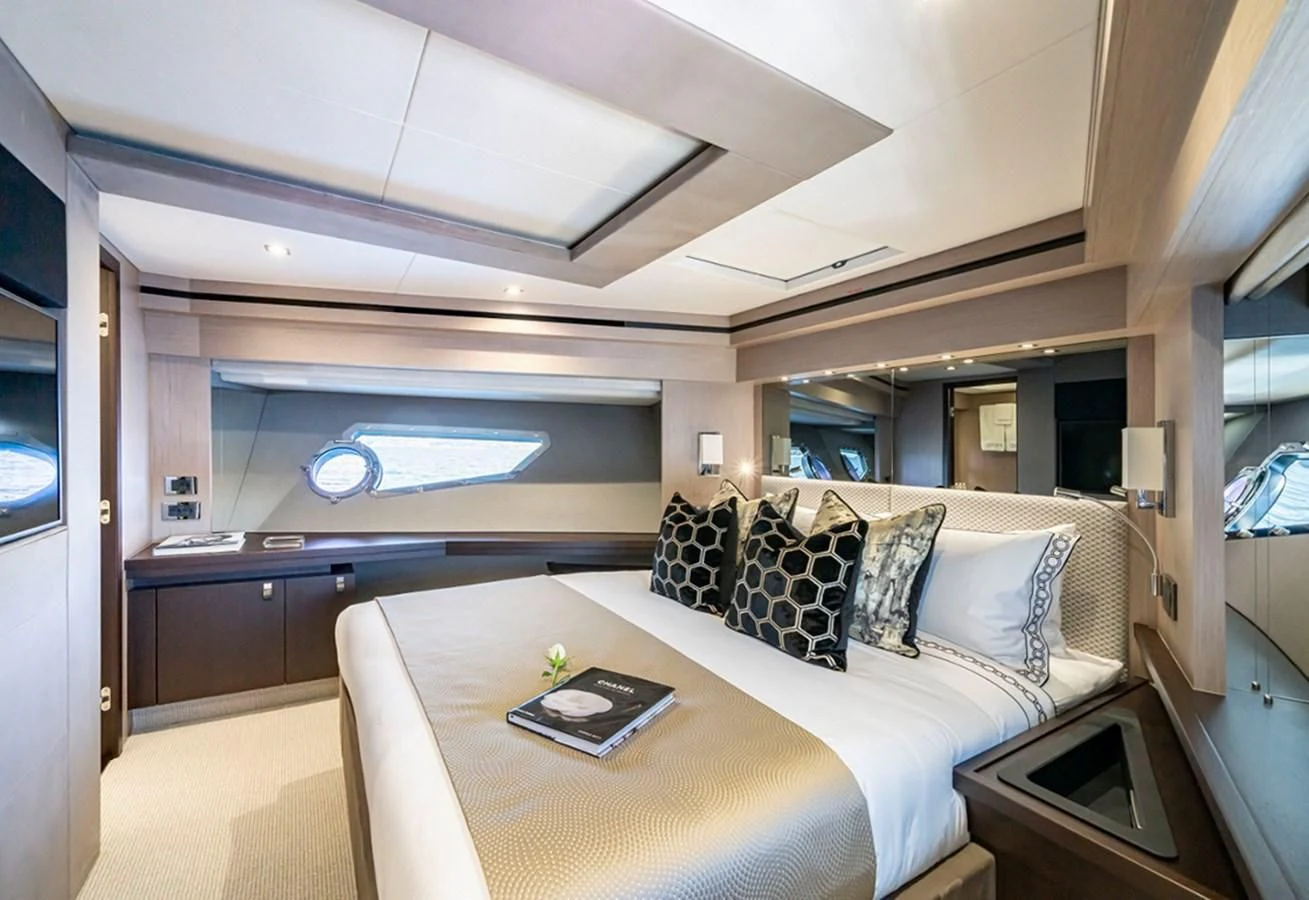 a large bedroom with a large bed aboard TORO Yacht for Sale