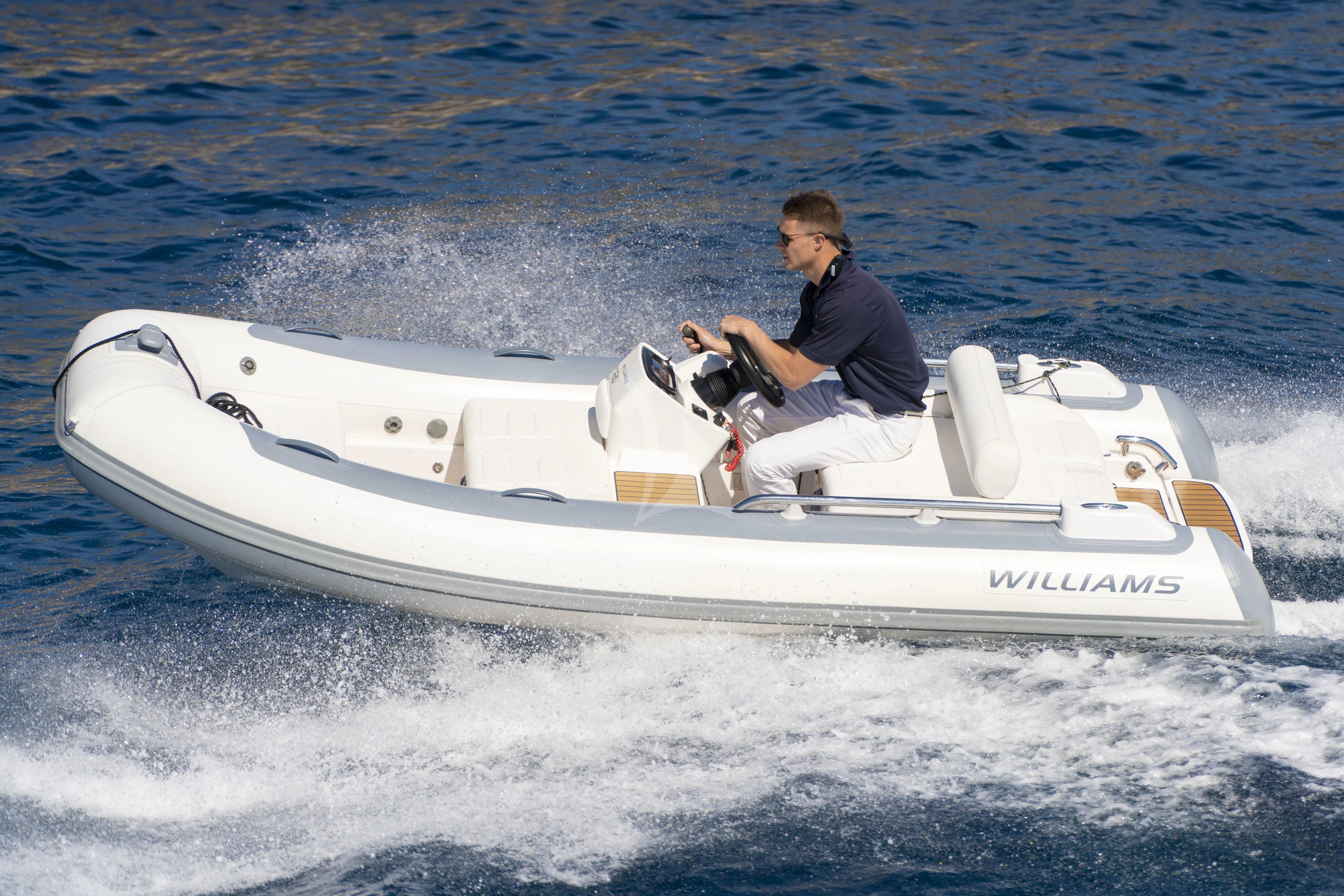 a person on a speedboat aboard TORO Yacht for Sale