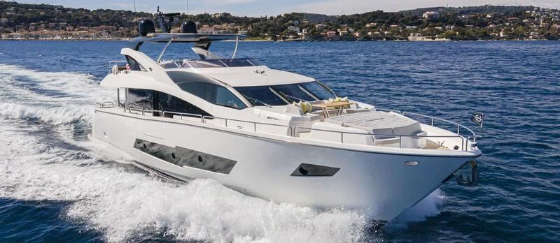 a white yacht on the water aboard TORO Yacht for Sale