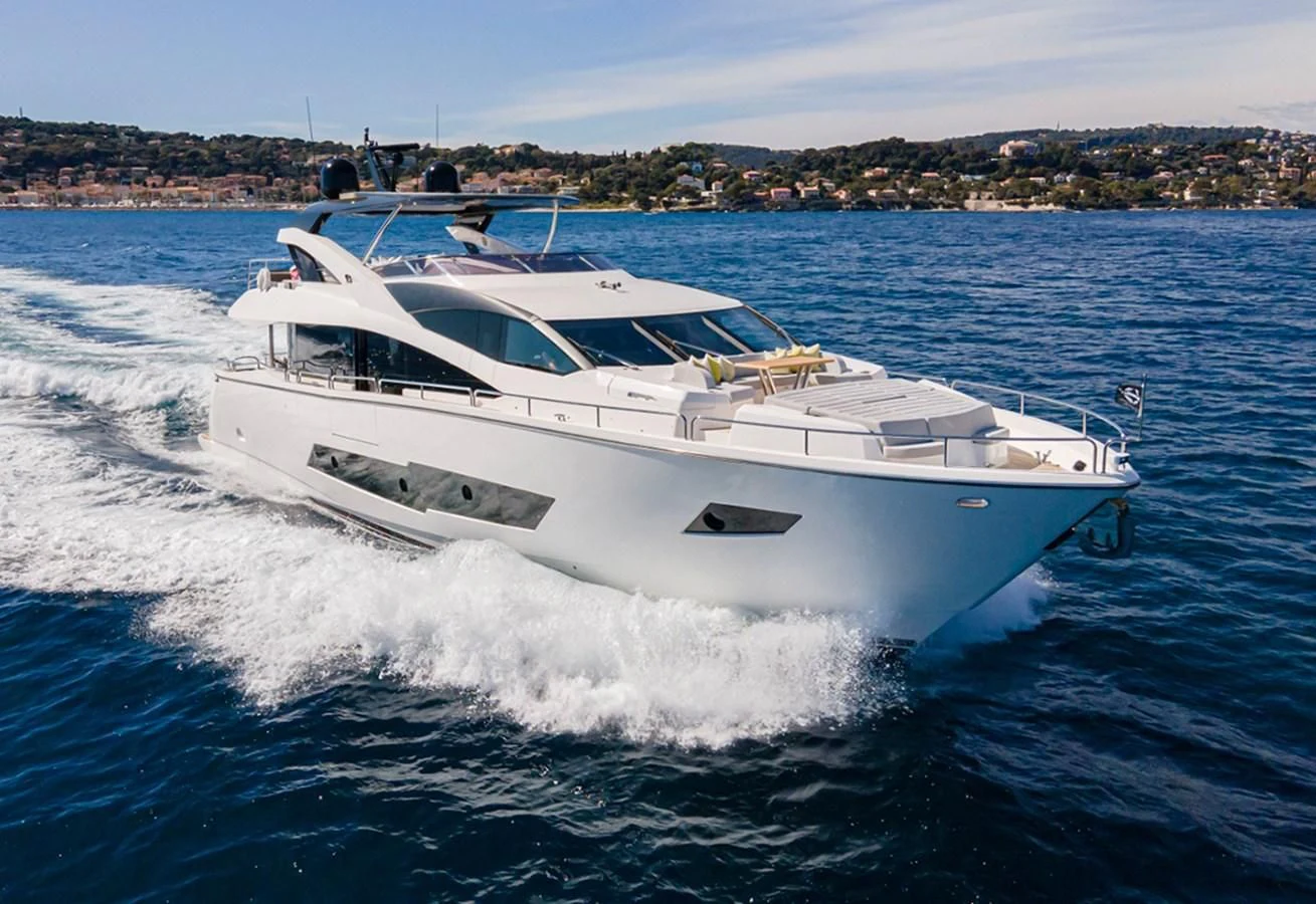 a white boat on the water aboard TORO Yacht for Sale
