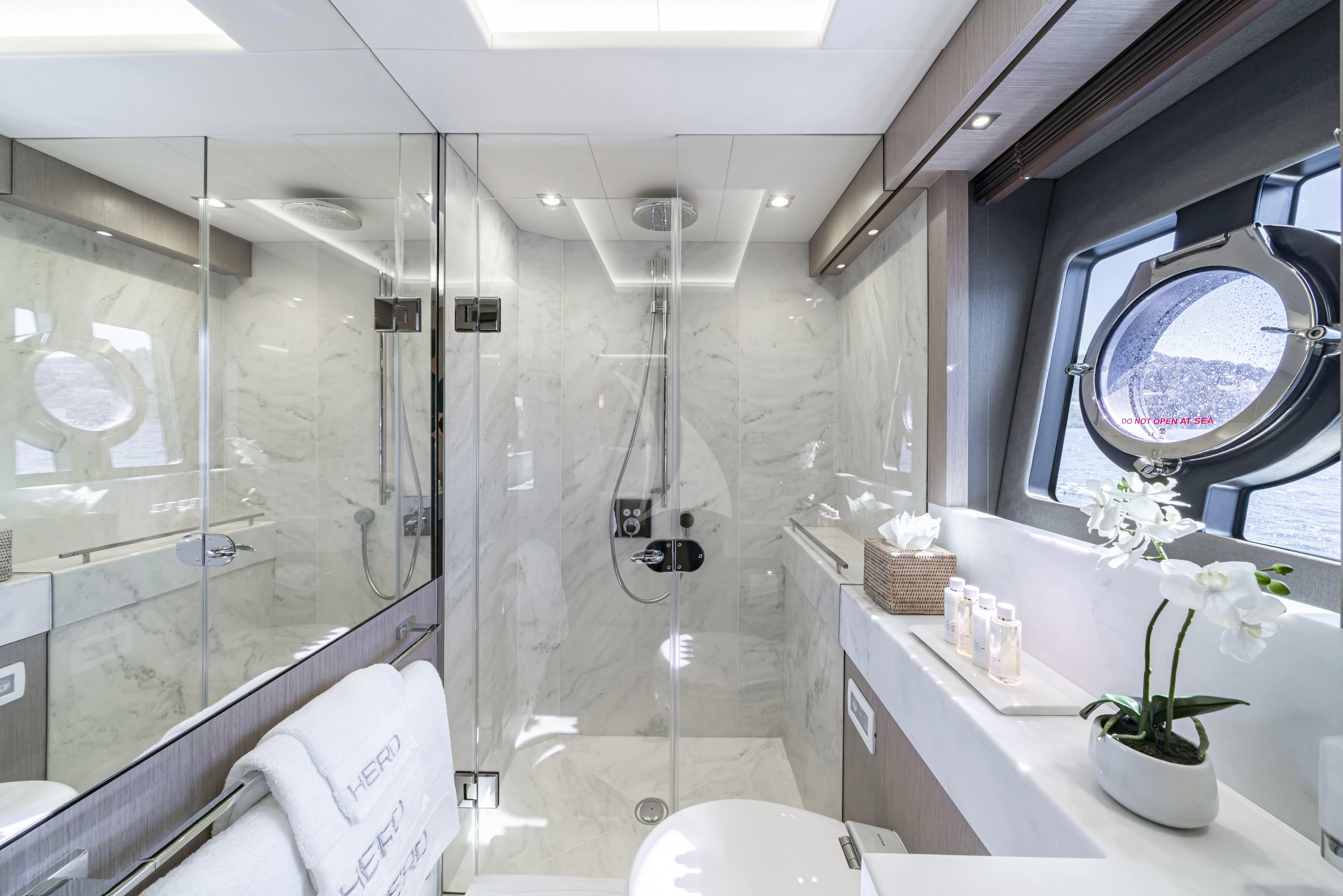 a bathroom with a shower and a sink aboard TORO Yacht for Sale