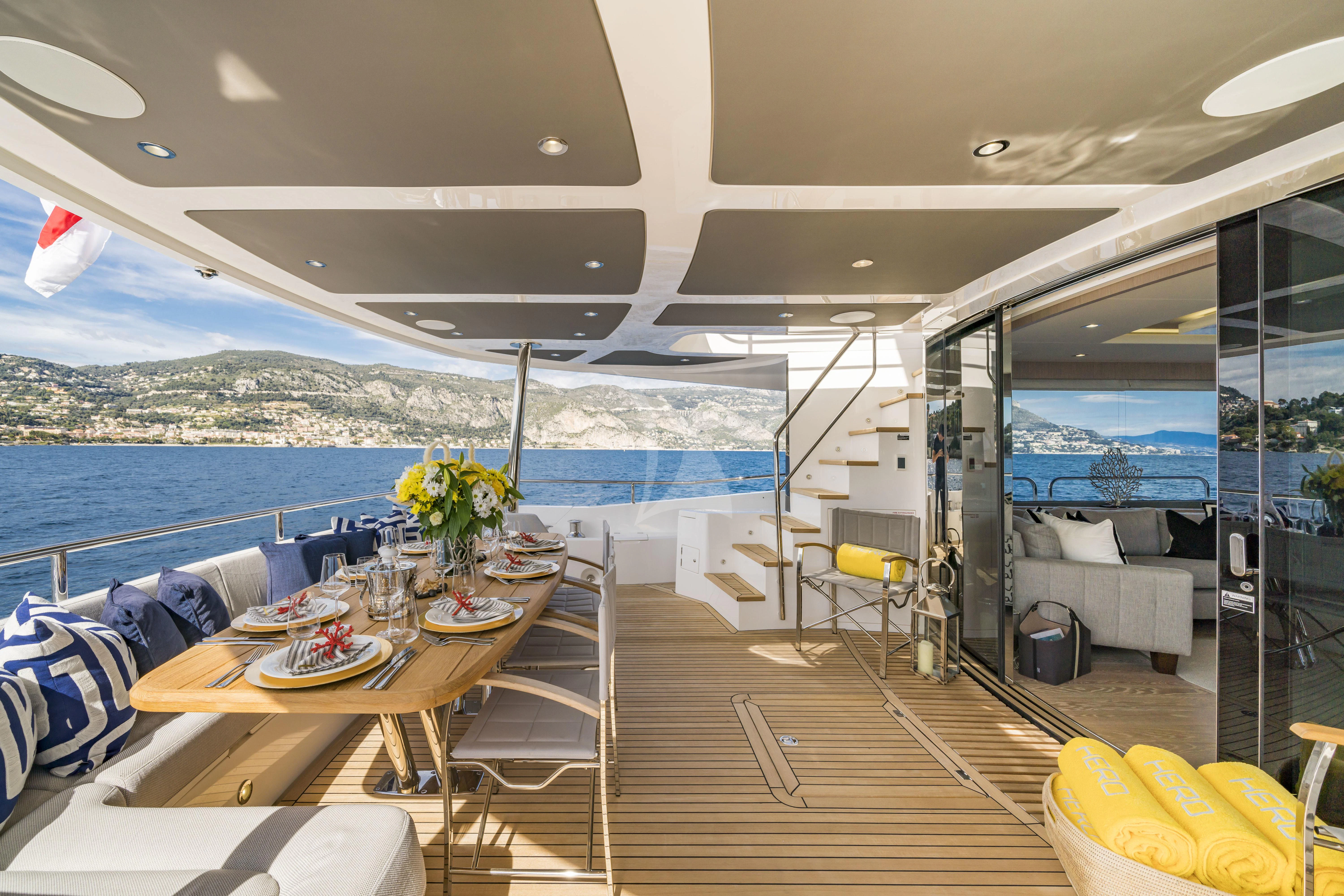 a room with a table and chairs aboard TORO Yacht for Sale