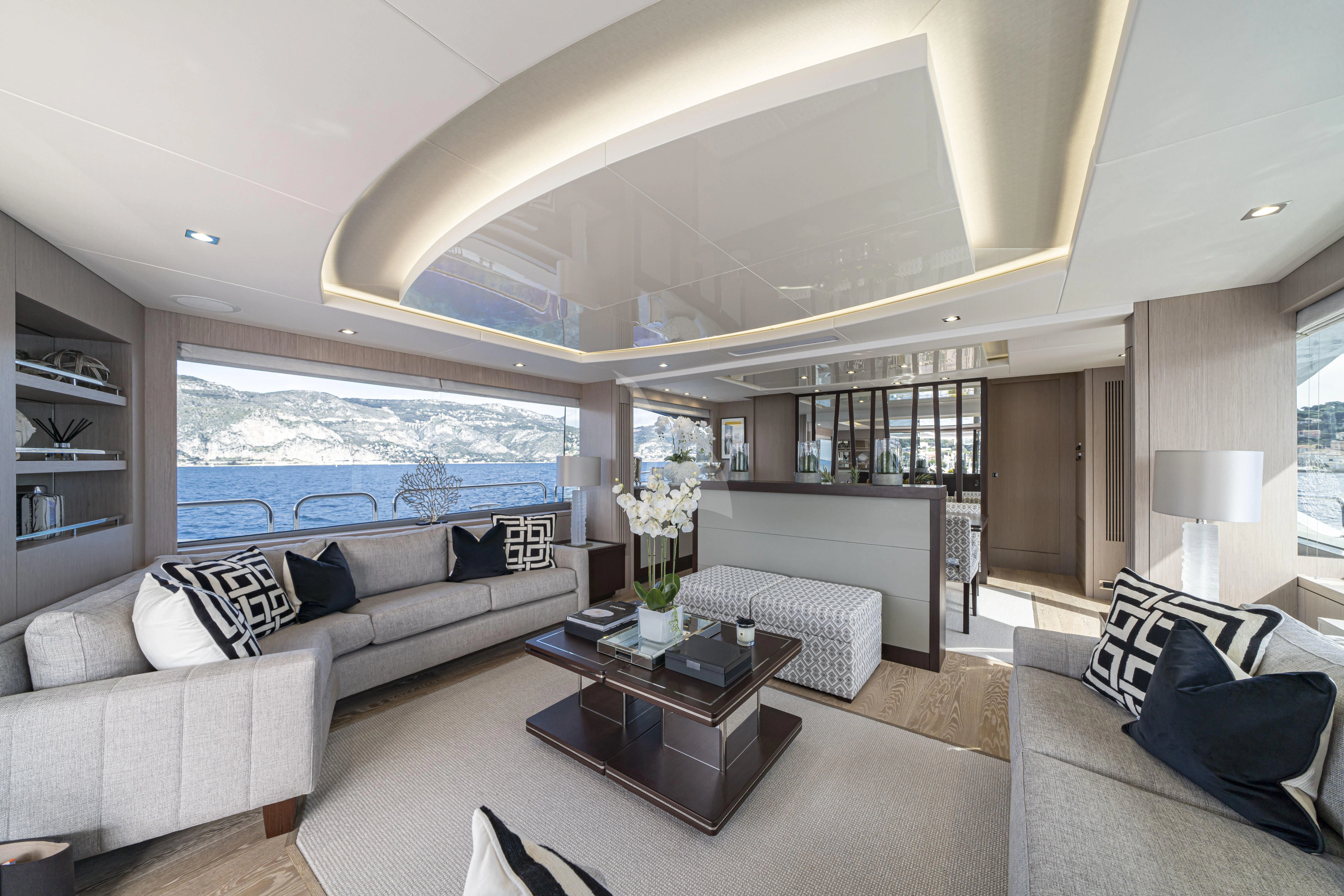 a living room with a large window aboard TORO Yacht for Sale