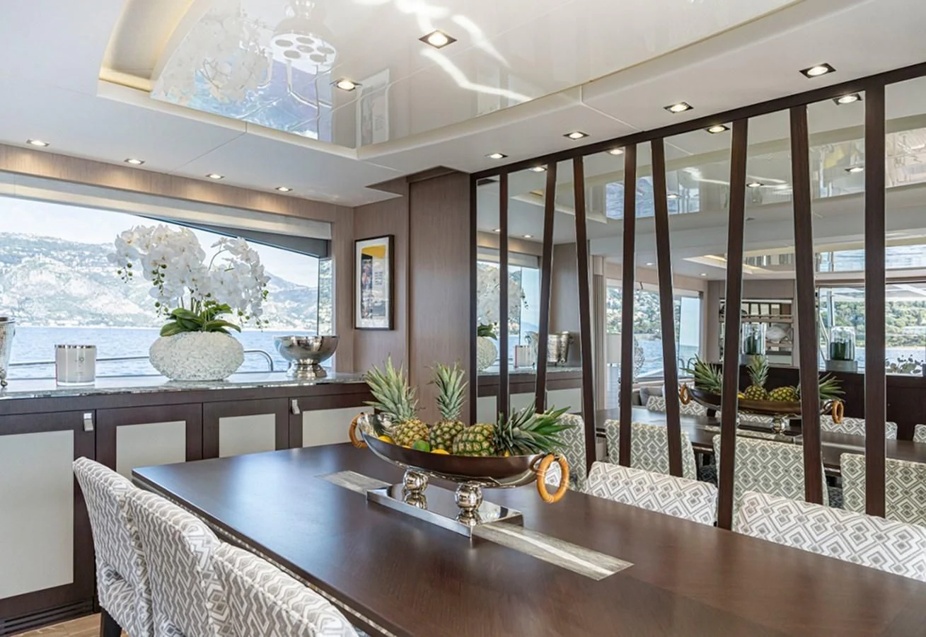 a modern looking kitchen with a large glass wall aboard TORO Yacht for Sale