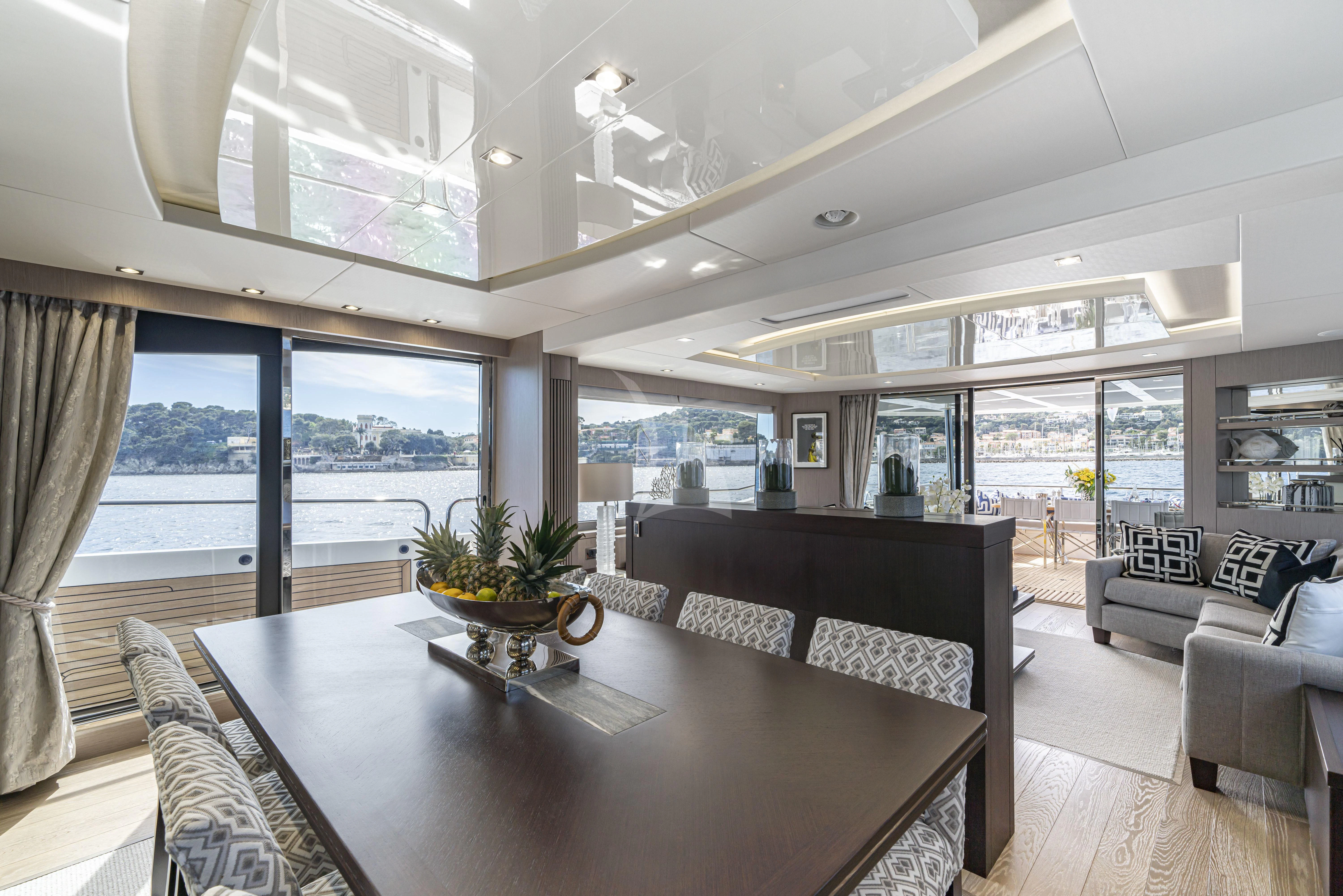 a living room with a large window aboard TORO Yacht for Sale