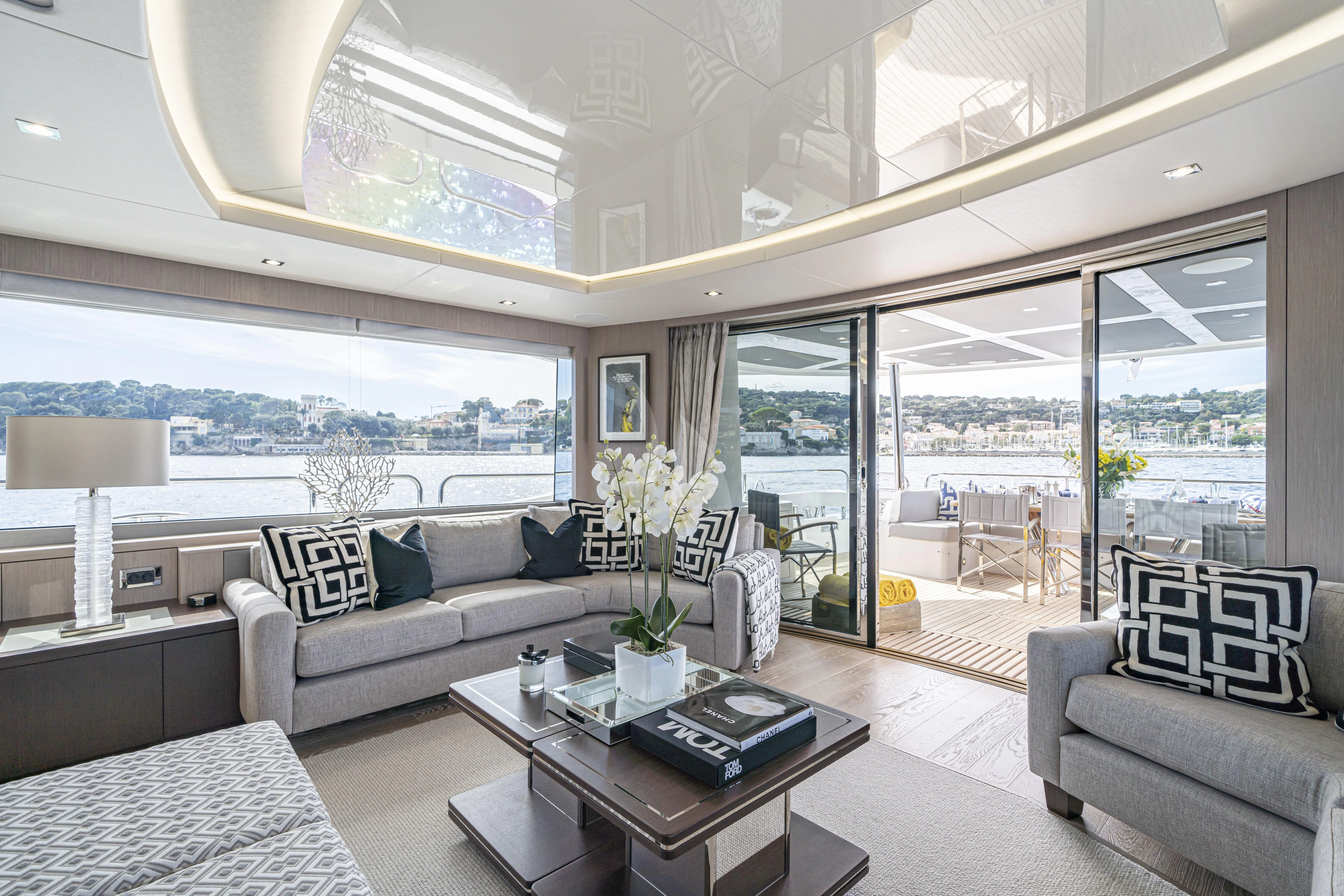 a living room with a large glass window aboard TORO Yacht for Sale