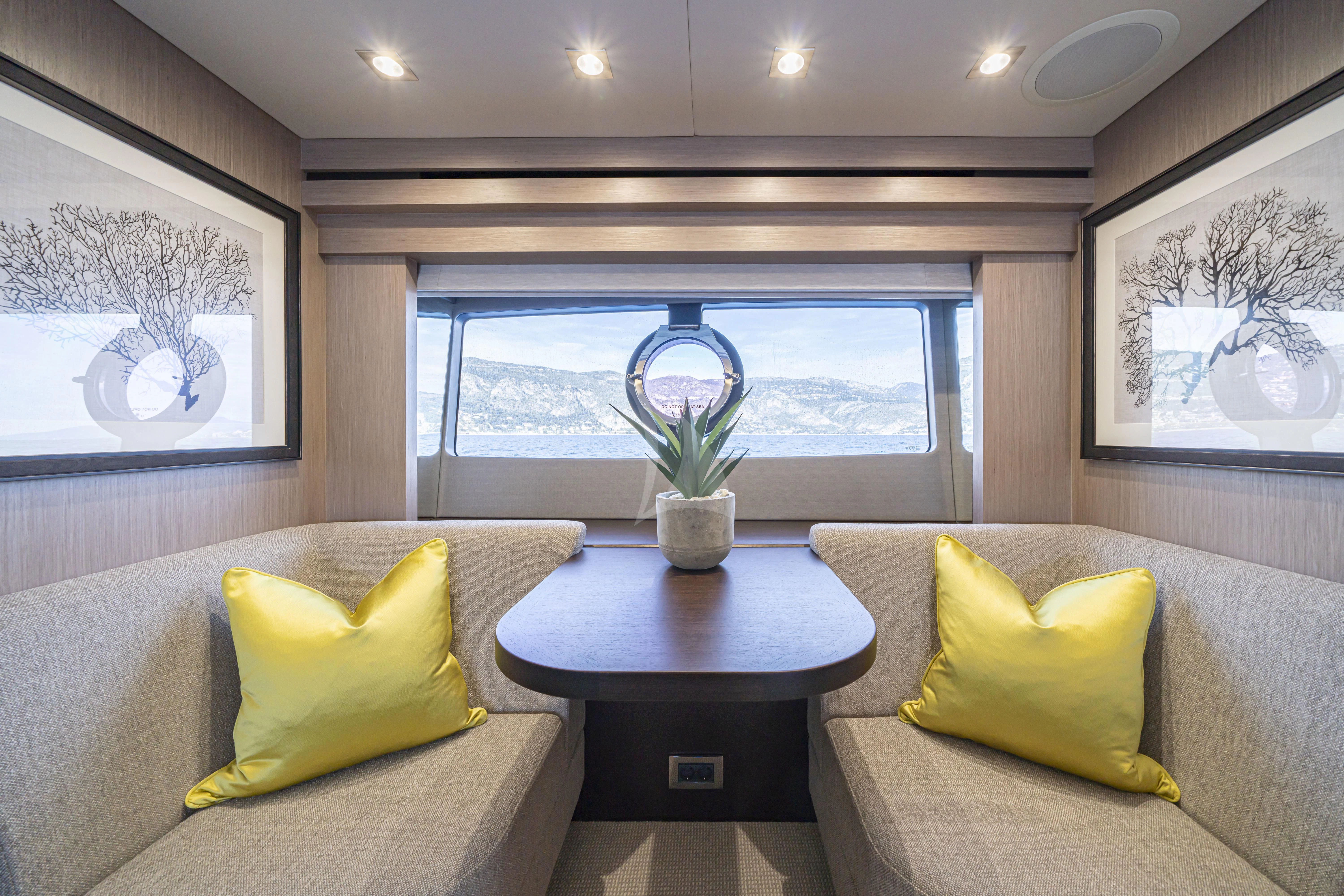 a living room with a large window aboard TORO Yacht for Sale