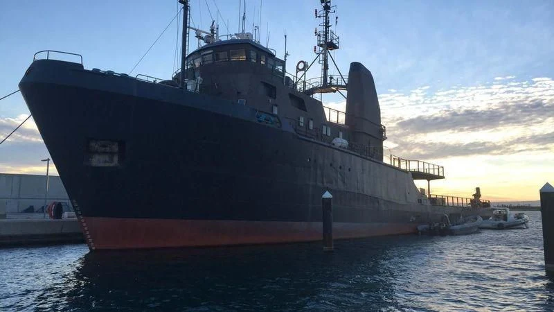 a large ship in the water aboard AFTHONIA V Yacht for Sale