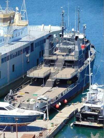 a large ship docked aboard AFTHONIA V Yacht for Sale