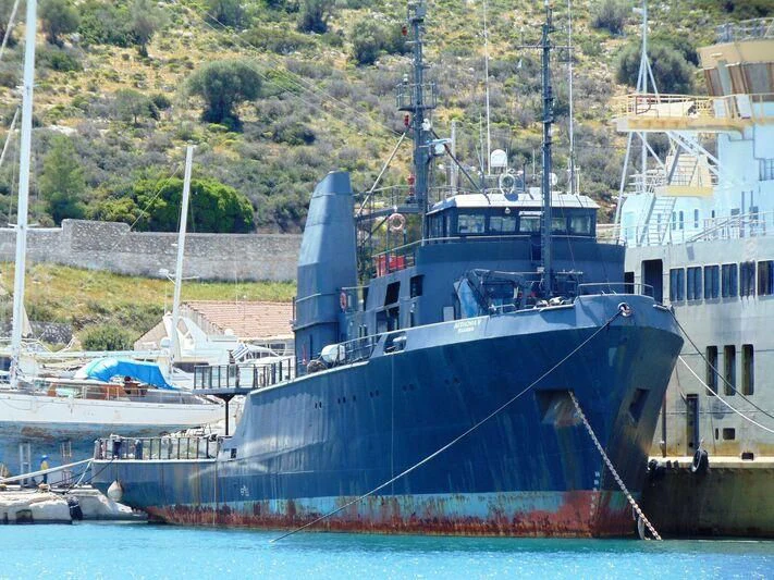 a boat docked at a pier aboard AFTHONIA V Yacht for Sale