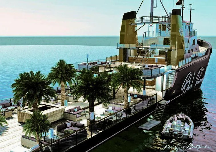 a large ship docked at a port aboard AFTHONIA V Yacht for Sale