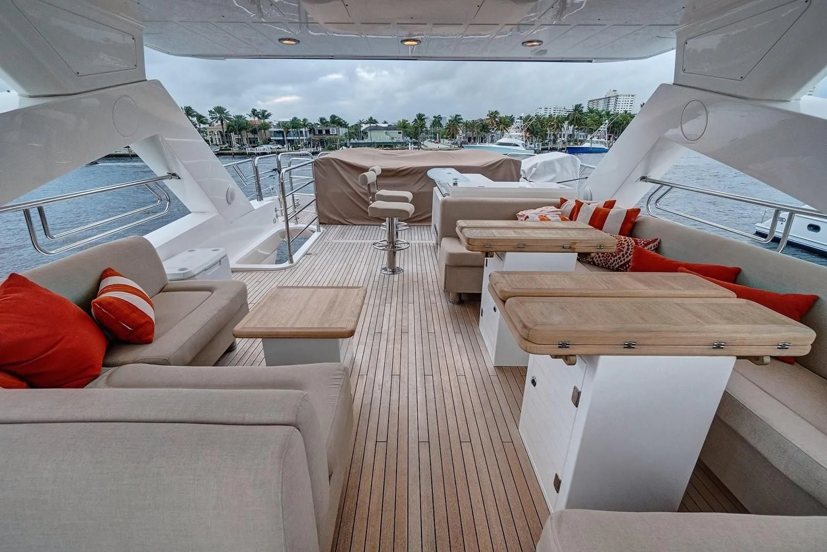 a room with a deck and chairs aboard SPLASHED OUT Yacht for Sale