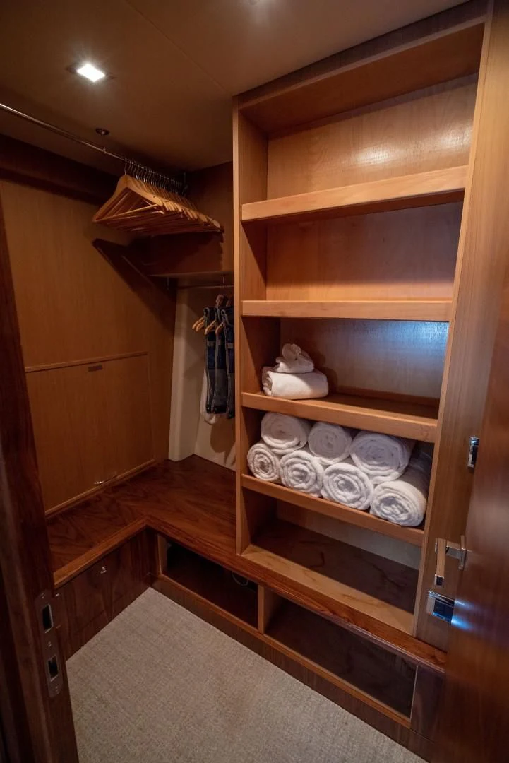 a wooden cabinet with shelves aboard SPLASHED OUT Yacht for Sale