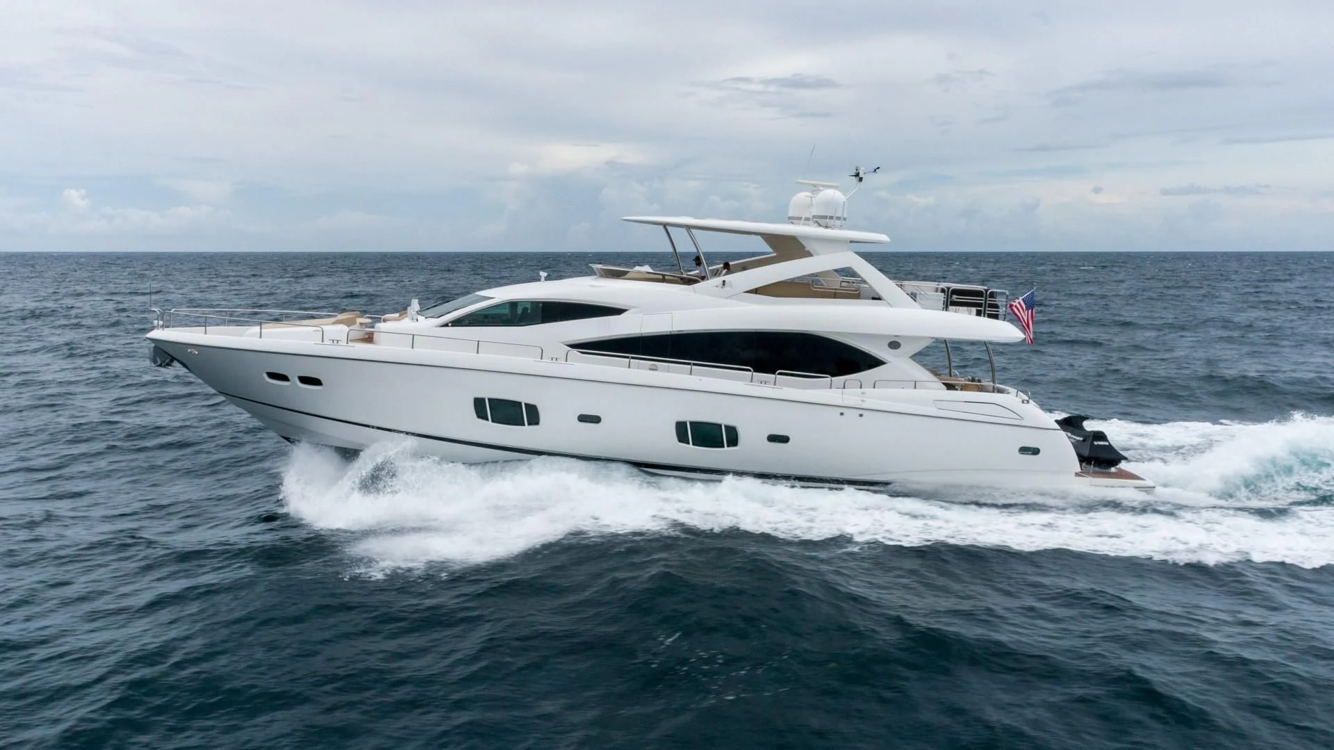 a white yacht in the water aboard SPLASHED OUT Yacht for Sale