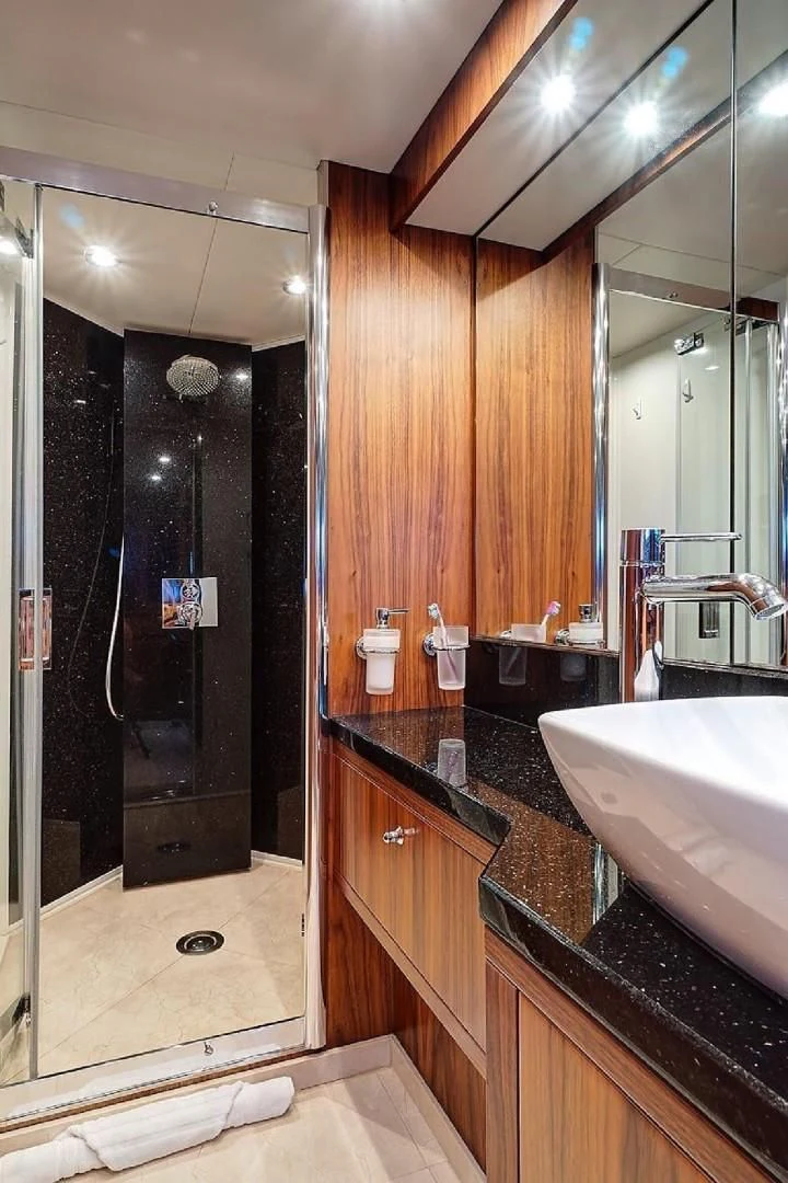 a bathroom with a large shower aboard SPLASHED OUT Yacht for Sale