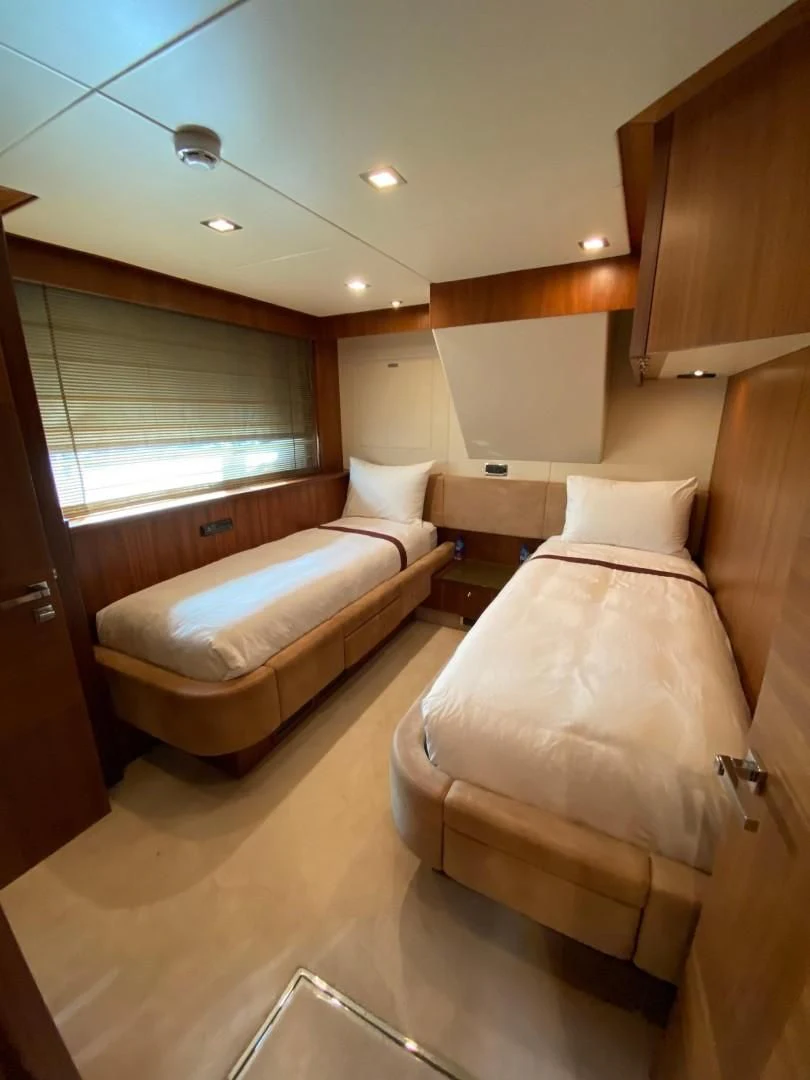 a room with two beds aboard SPLASHED OUT Yacht for Sale