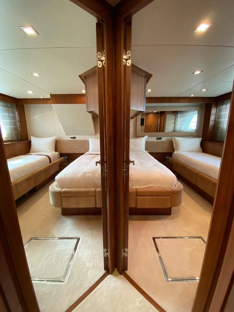 a room with a bed and a wood frame aboard SPLASHED OUT Yacht for Sale