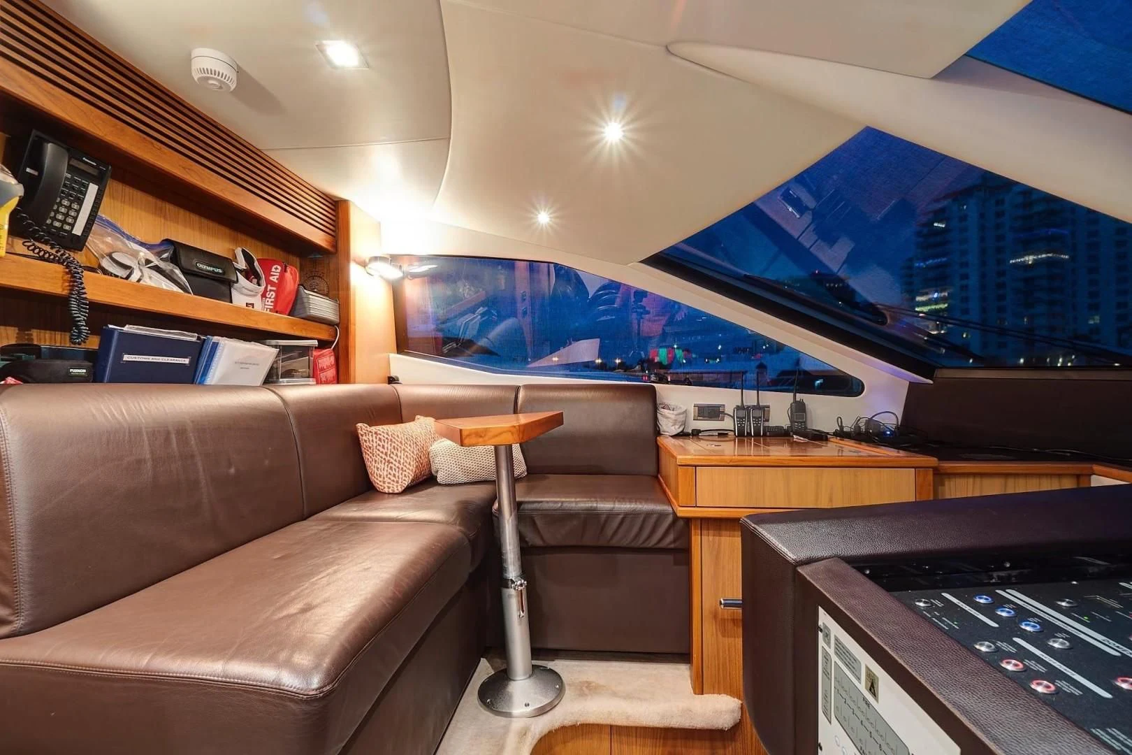 a living room with a couch and a tv aboard SPLASHED OUT Yacht for Sale