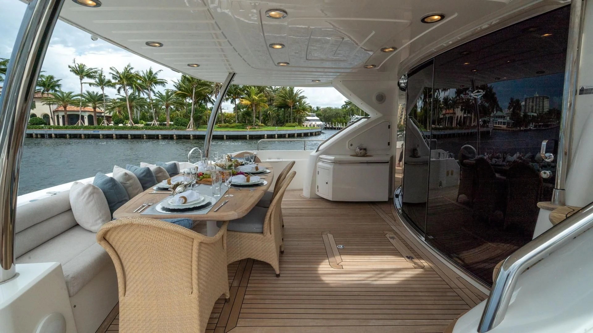 a boat with a table and chairs aboard SPLASHED OUT Yacht for Sale