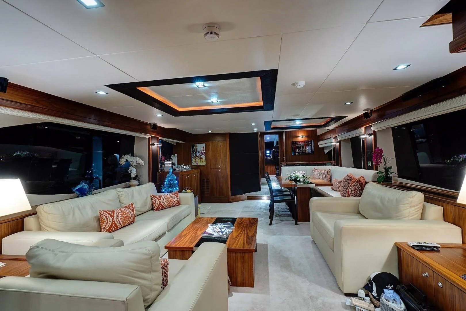 a living room with a couch and a table aboard SPLASHED OUT Yacht for Sale