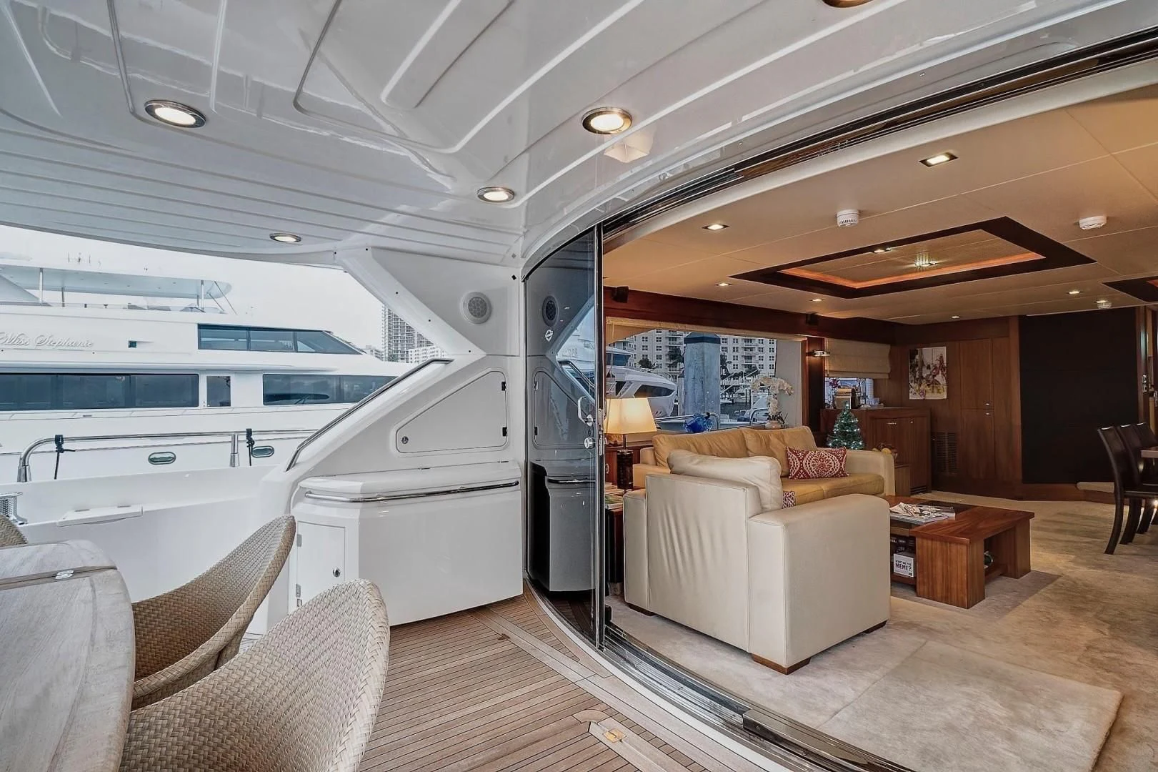 a large living room with a large open door aboard SPLASHED OUT Yacht for Sale