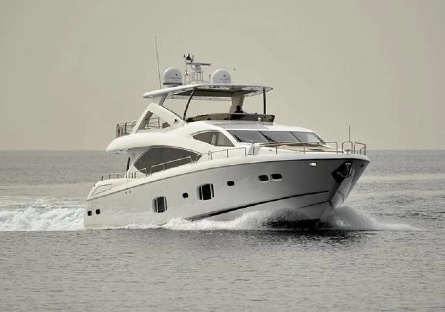 a white yacht in the water aboard SPLASHED OUT Yacht for Sale