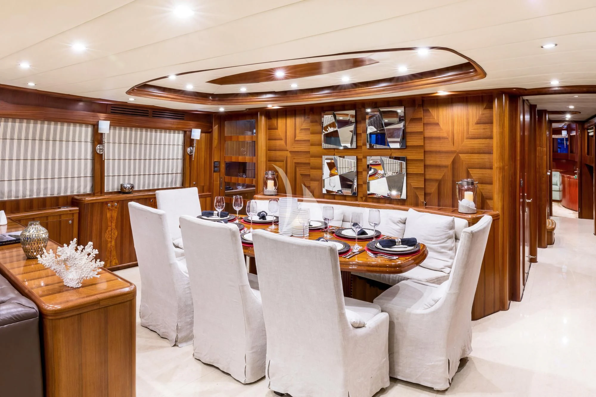 a large room with a table and chairs aboard JULIA DOROTHY Yacht for Sale