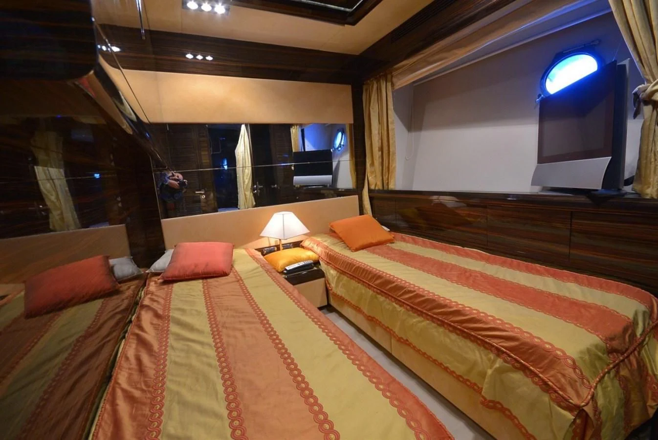 a room with a bed and a desk aboard JULIA DOROTHY Yacht for Sale