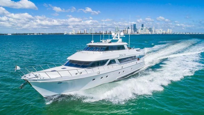 a white yacht on the water aboard JULIA DOROTHY Yacht for Sale