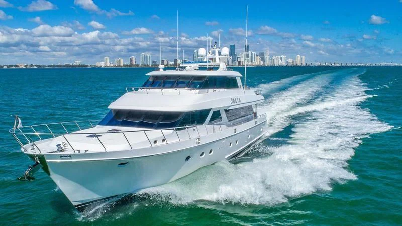 a white boat on the water aboard JULIA DOROTHY Yacht for Sale
