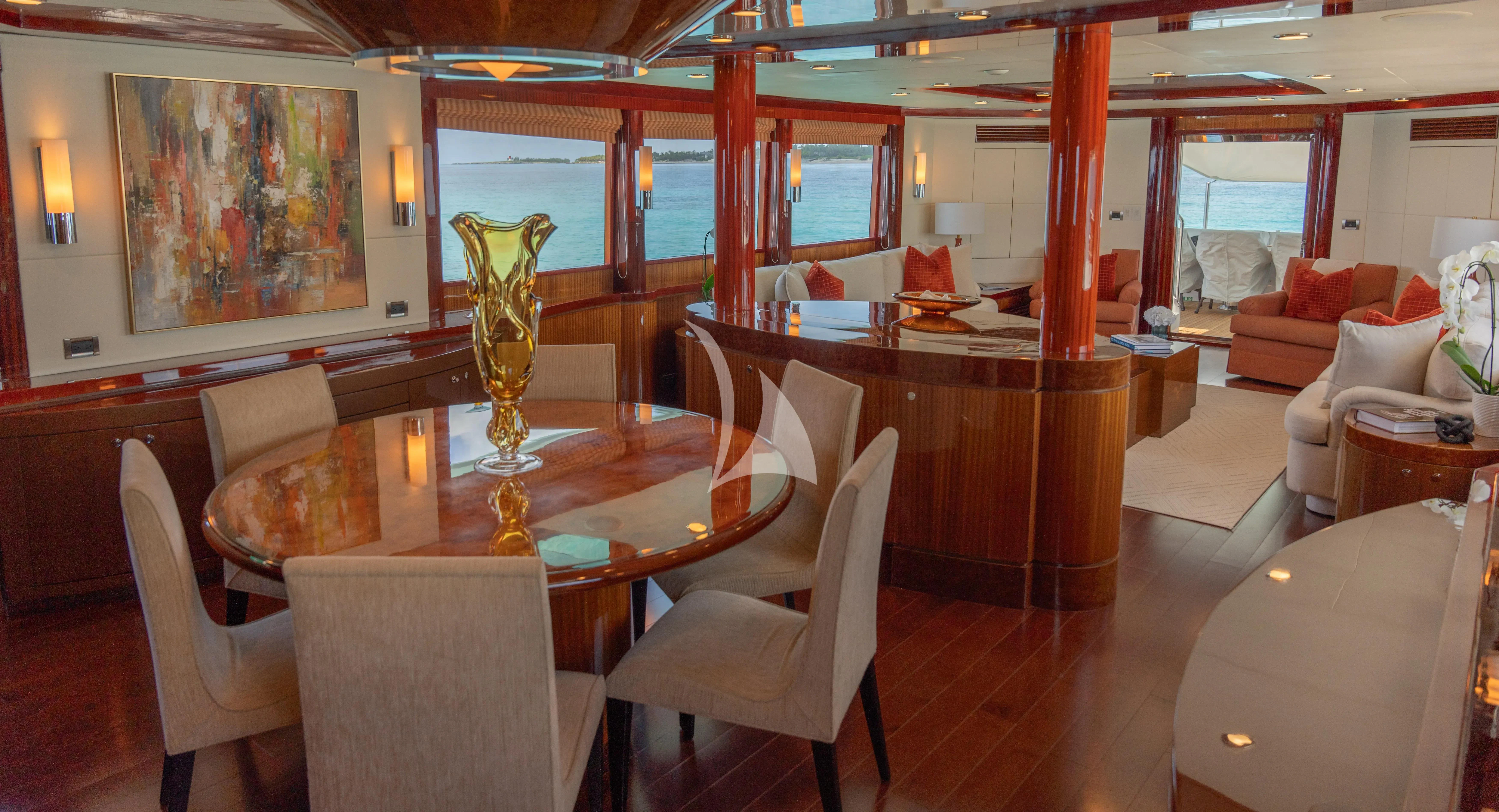 a large room with a table and chairs aboard JULIA DOROTHY Yacht for Sale