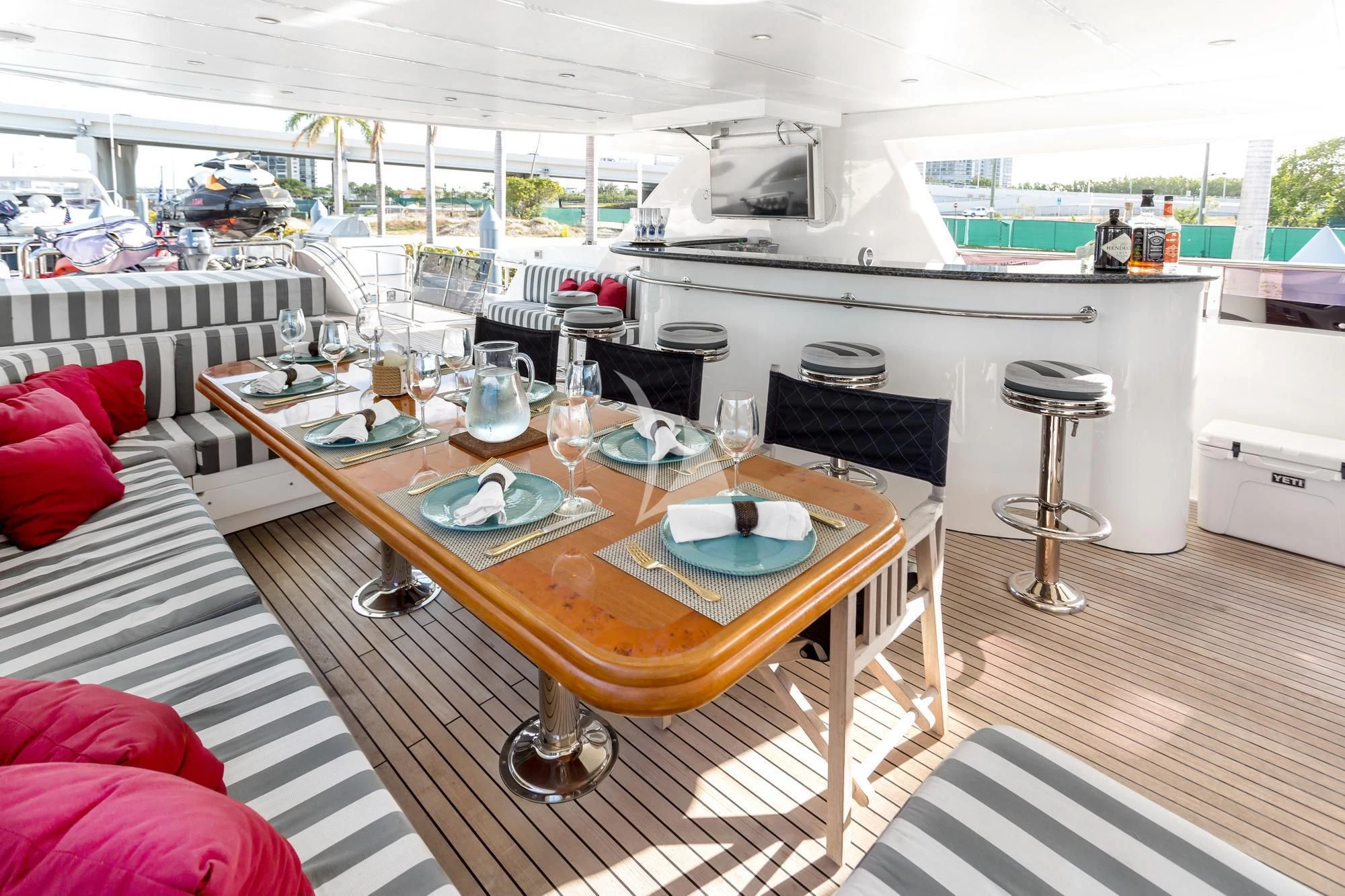a table with plates and glasses on it aboard JULIA DOROTHY Yacht for Sale