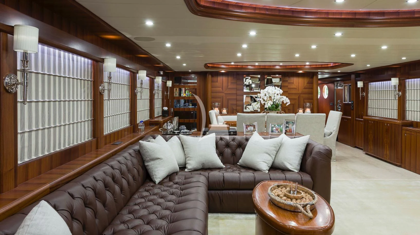 a living room with a couch and a coffee table aboard JULIA DOROTHY Yacht for Sale