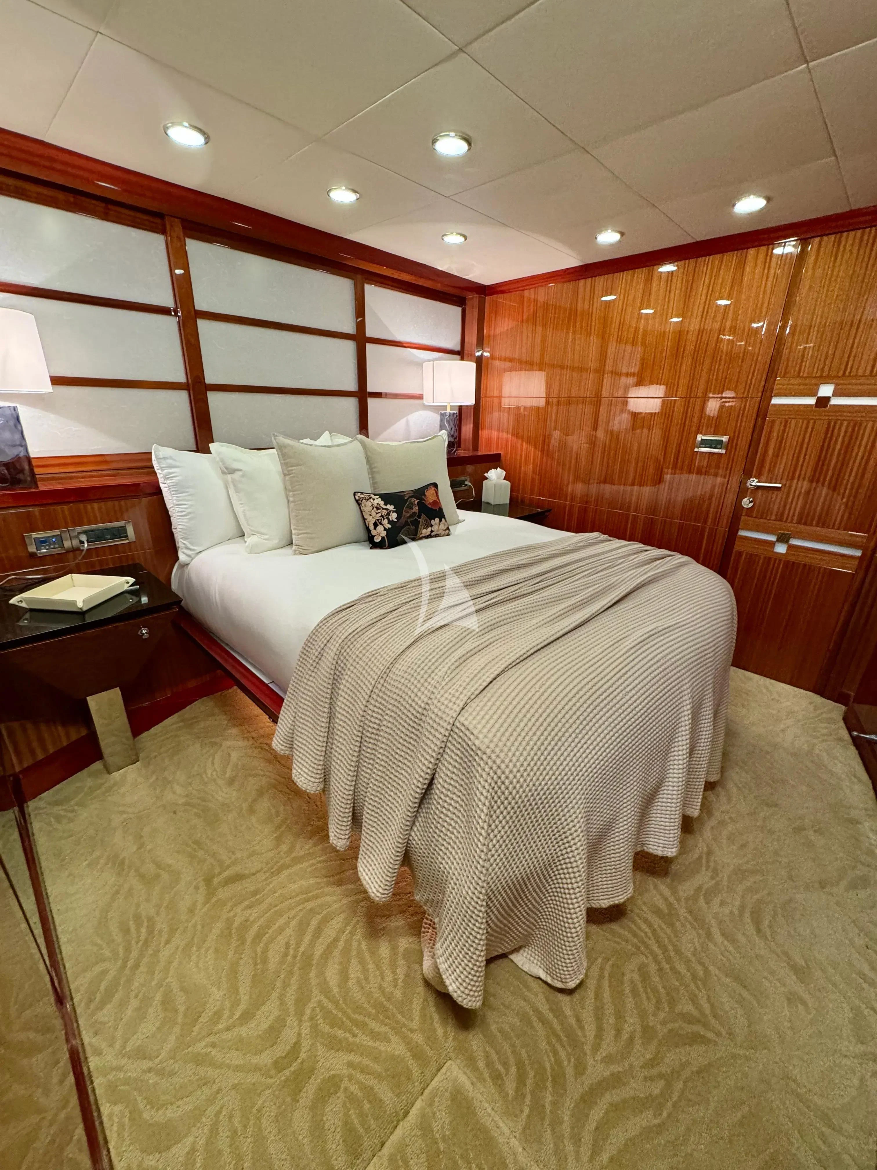 a room with a bed and a desk aboard JULIA DOROTHY Yacht for Sale