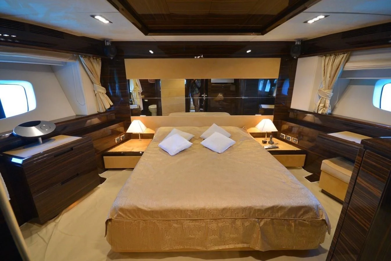 a room with a bed and desk aboard JULIA DOROTHY Yacht for Sale