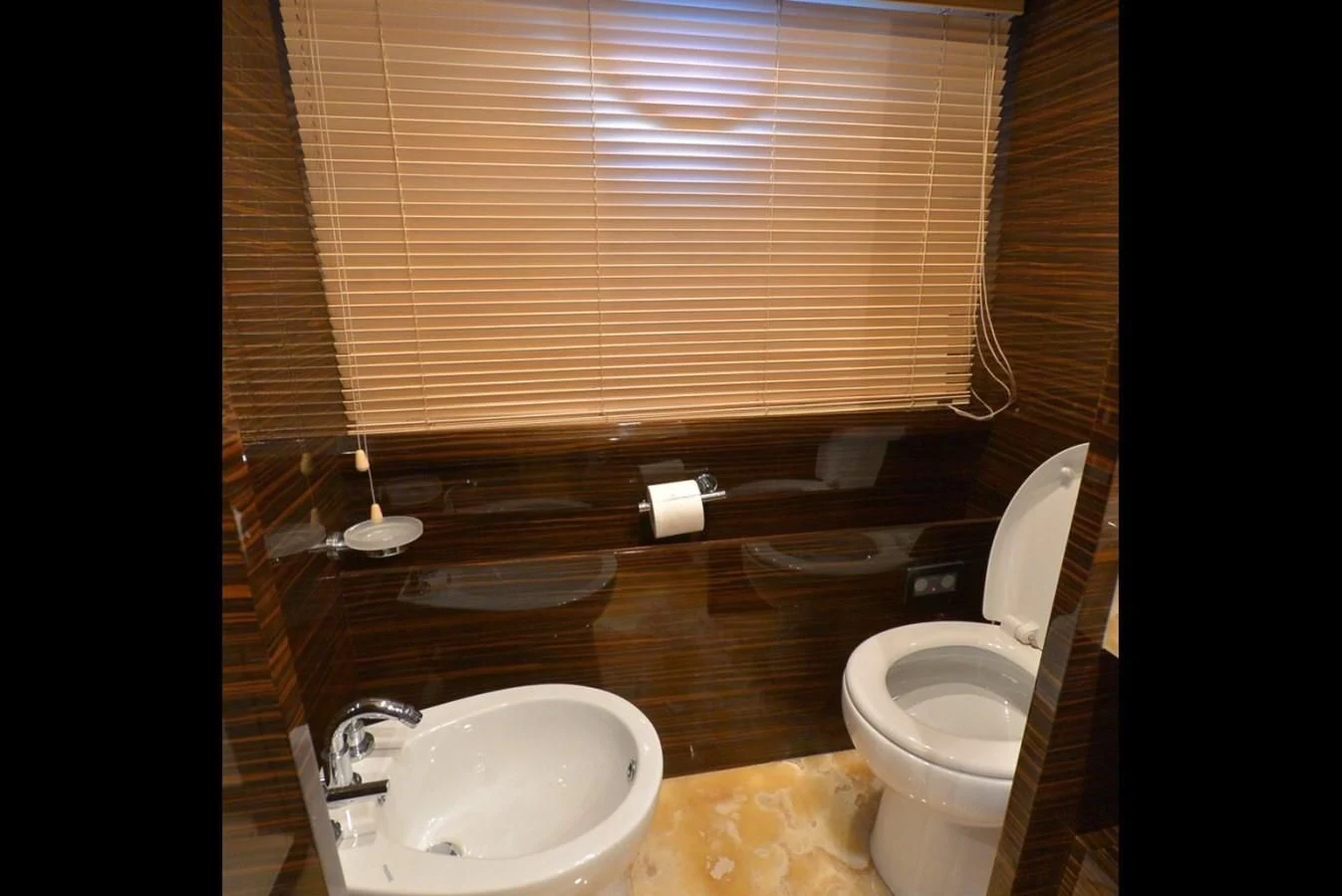 a bathroom with a toilet and sink aboard JULIA DOROTHY Yacht for Sale