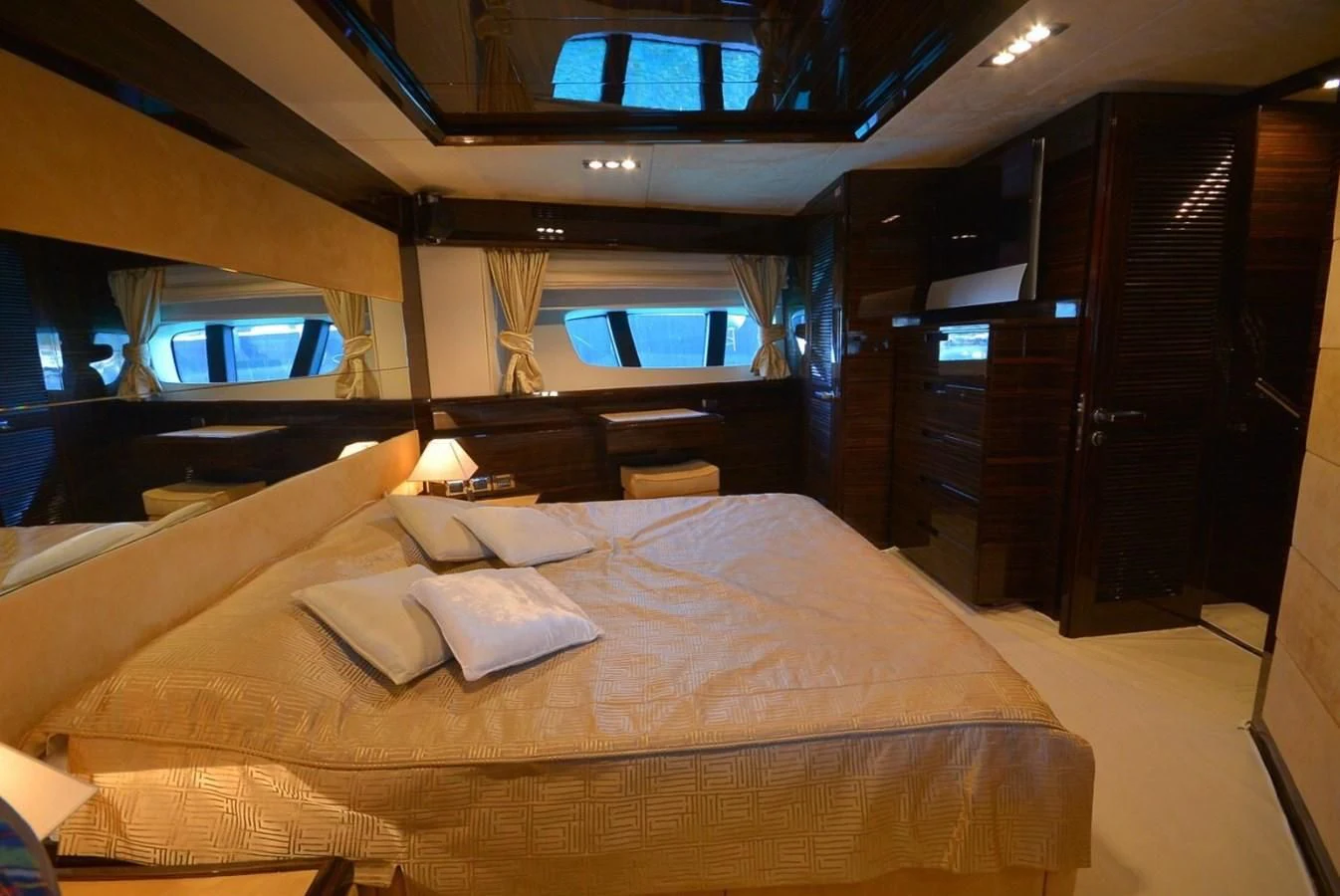 a room with a bed and a window aboard JULIA DOROTHY Yacht for Sale