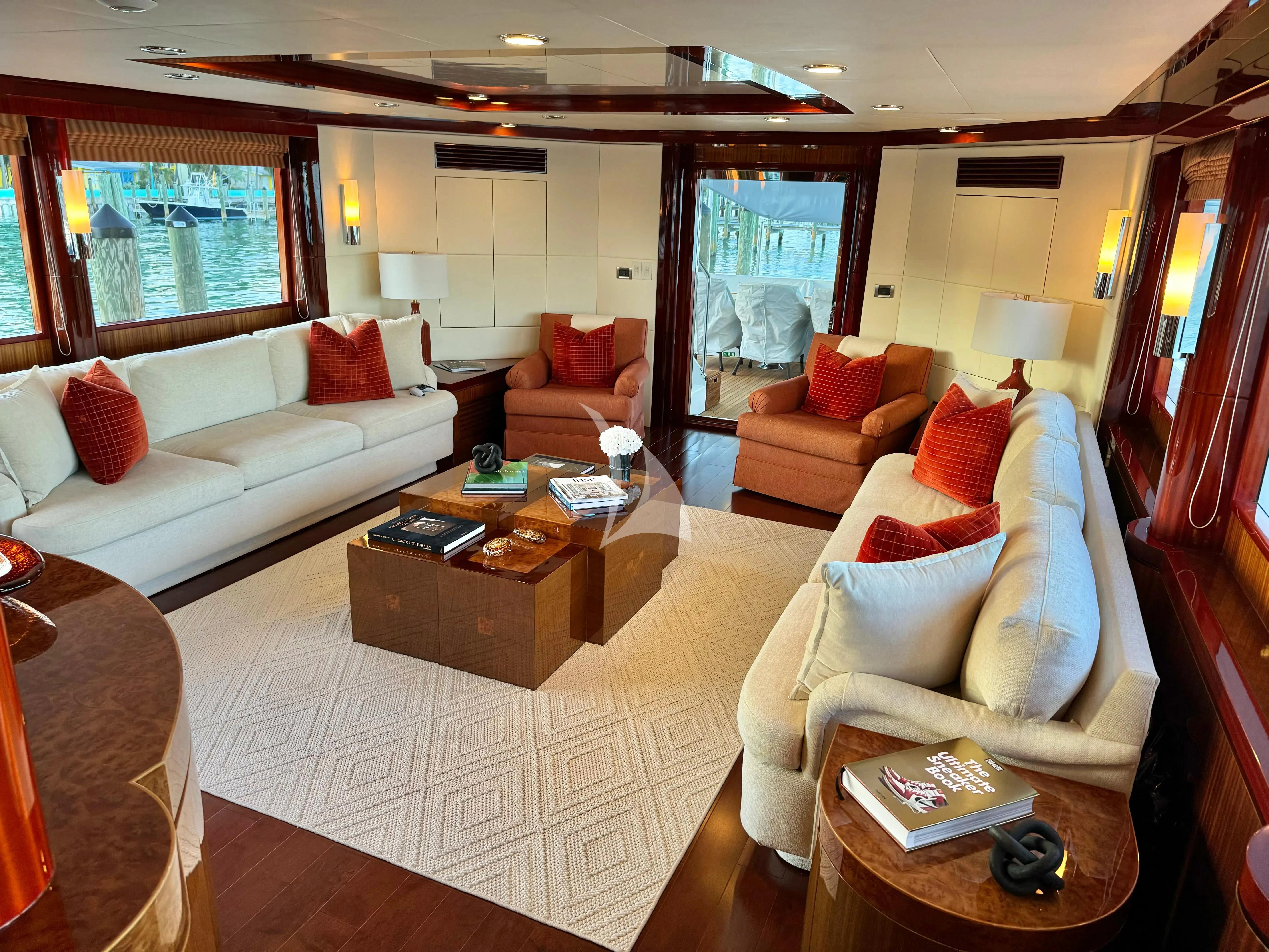a living room with a couch and a coffee table aboard JULIA DOROTHY Yacht for Sale