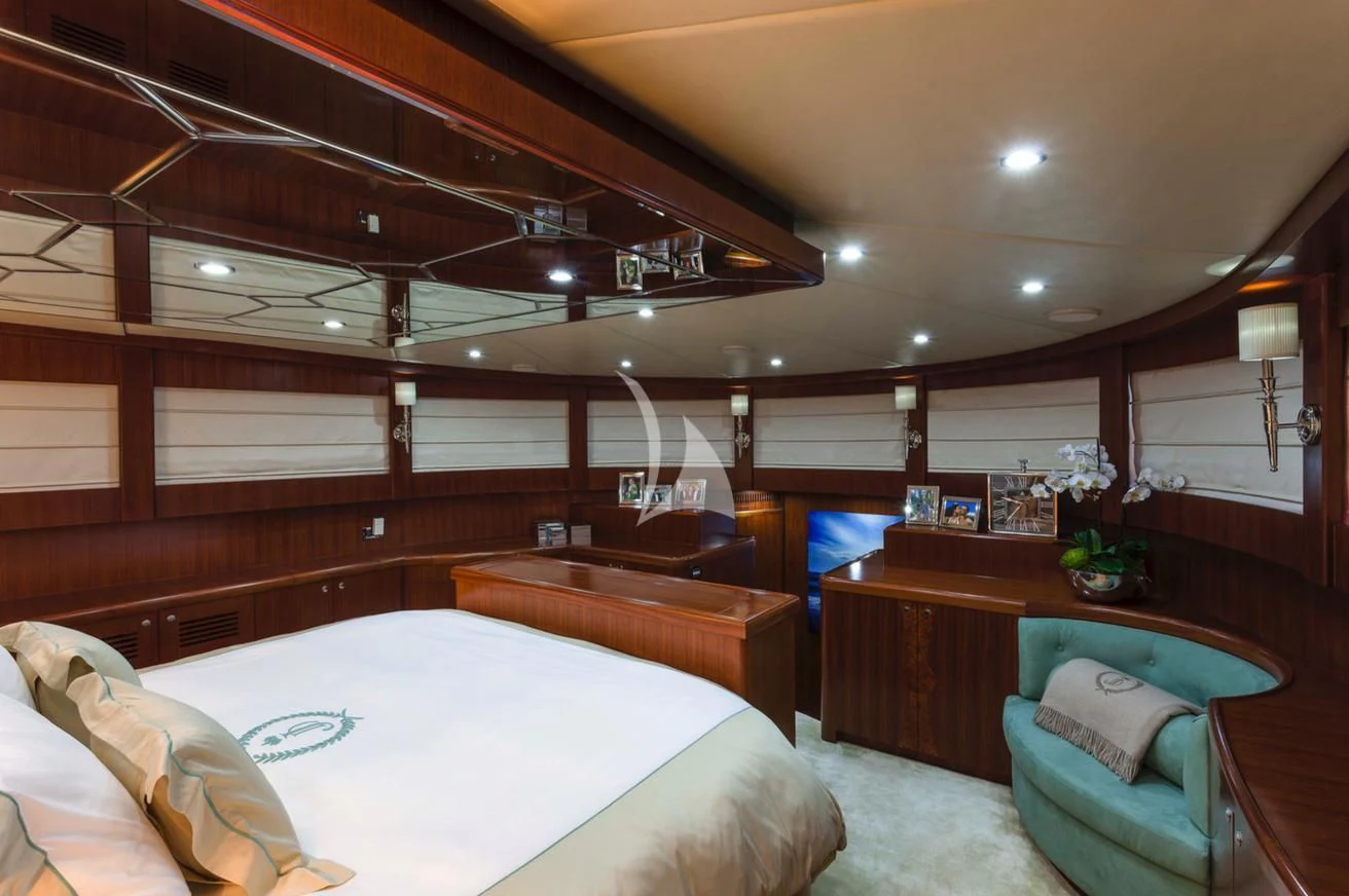 a room with a bed and a desk aboard JULIA DOROTHY Yacht for Sale