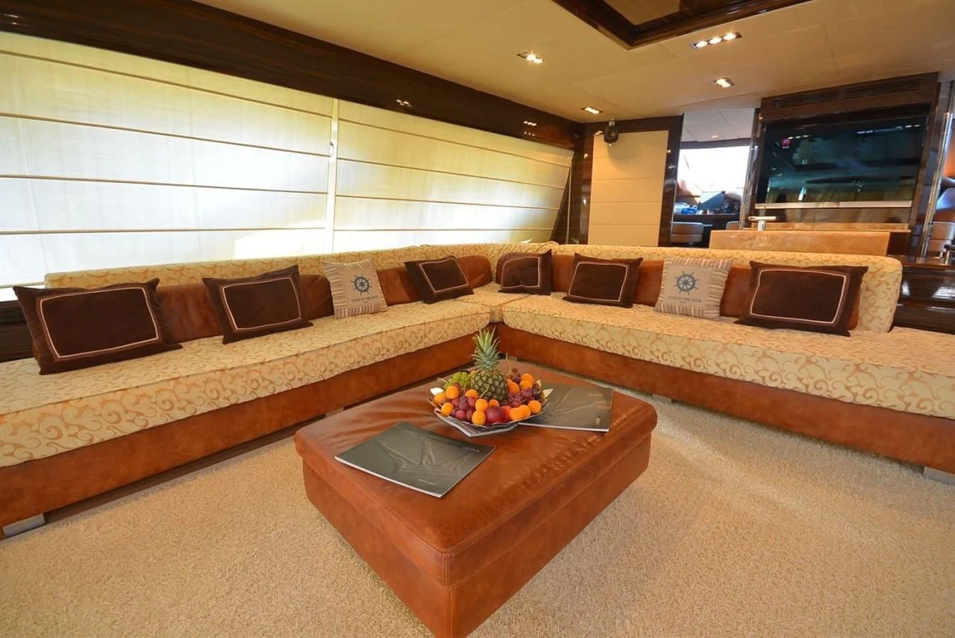 a living room with a couch and a coffee table aboard JULIA DOROTHY Yacht for Sale