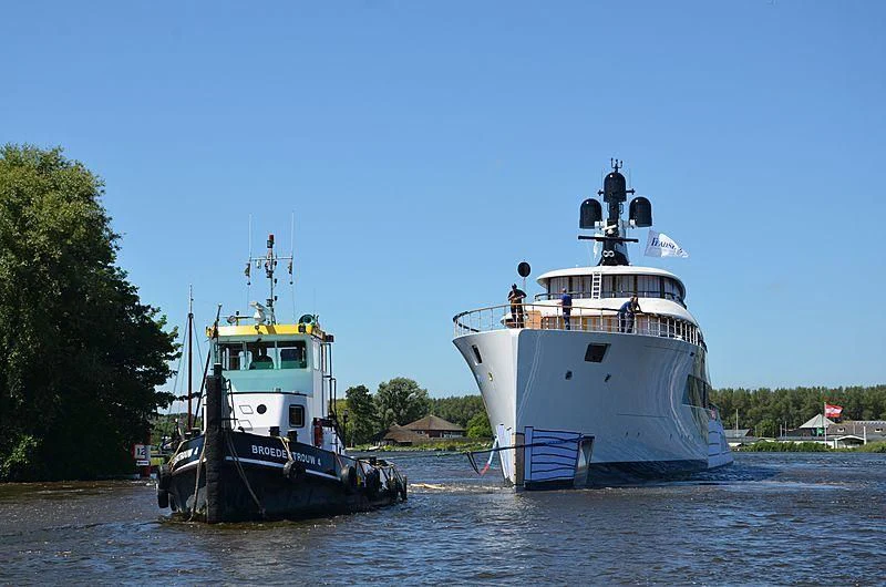 a couple of boats are in the water aboard 818 Yacht for Sale